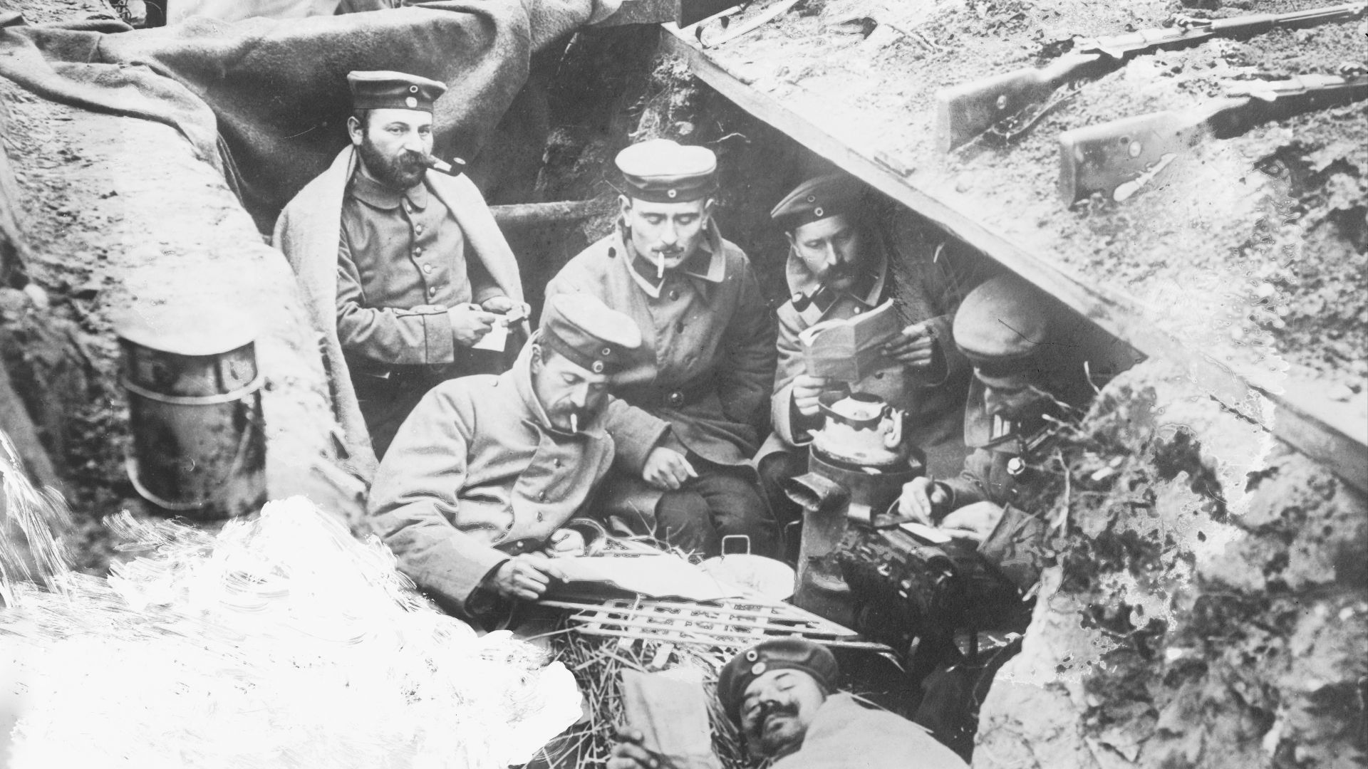A quiet moment in German trenches. German soldiers smoking and reading in a trench in Flanders, Belgium, during World War I.