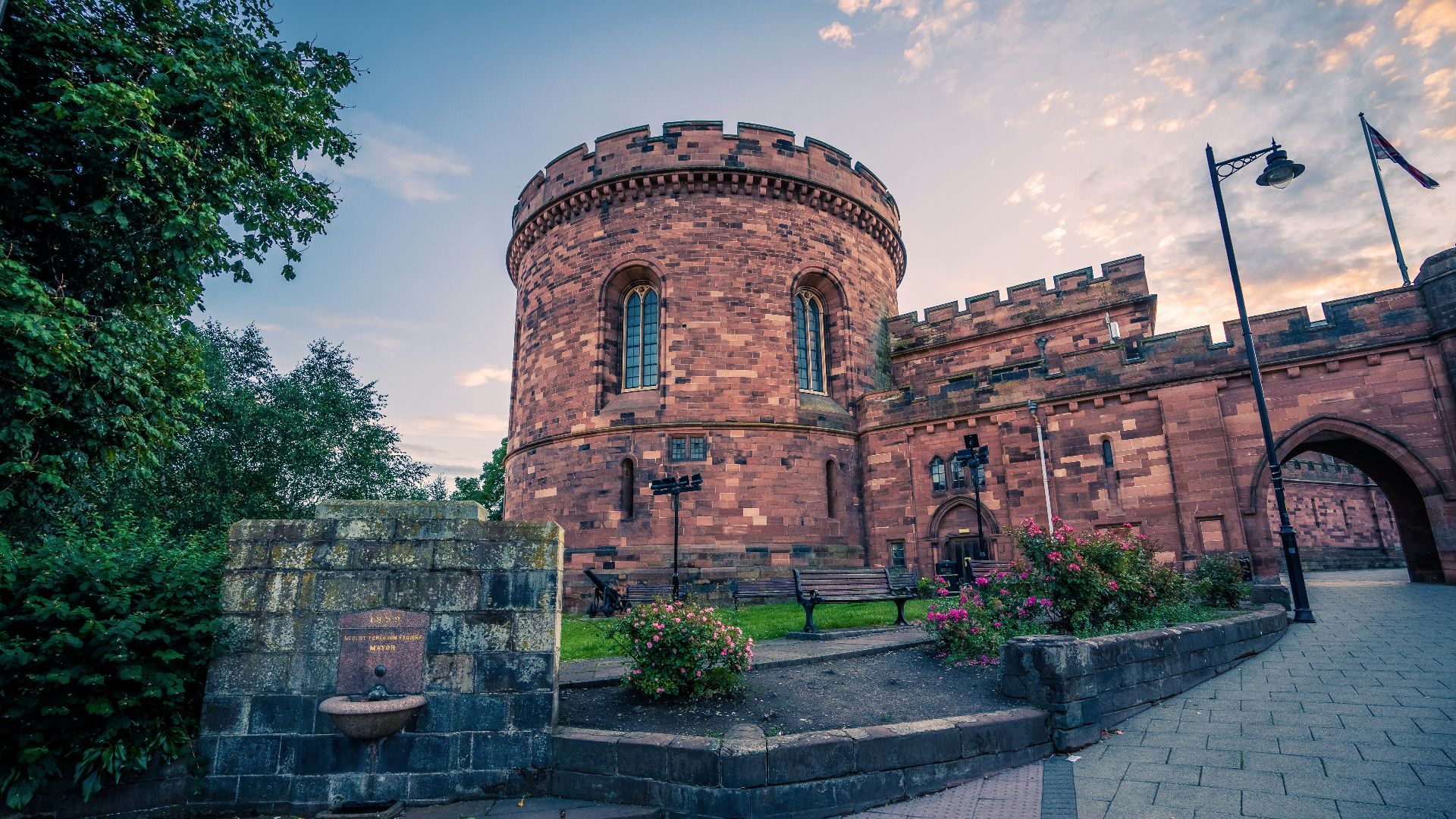 a brick building with a stone walkway