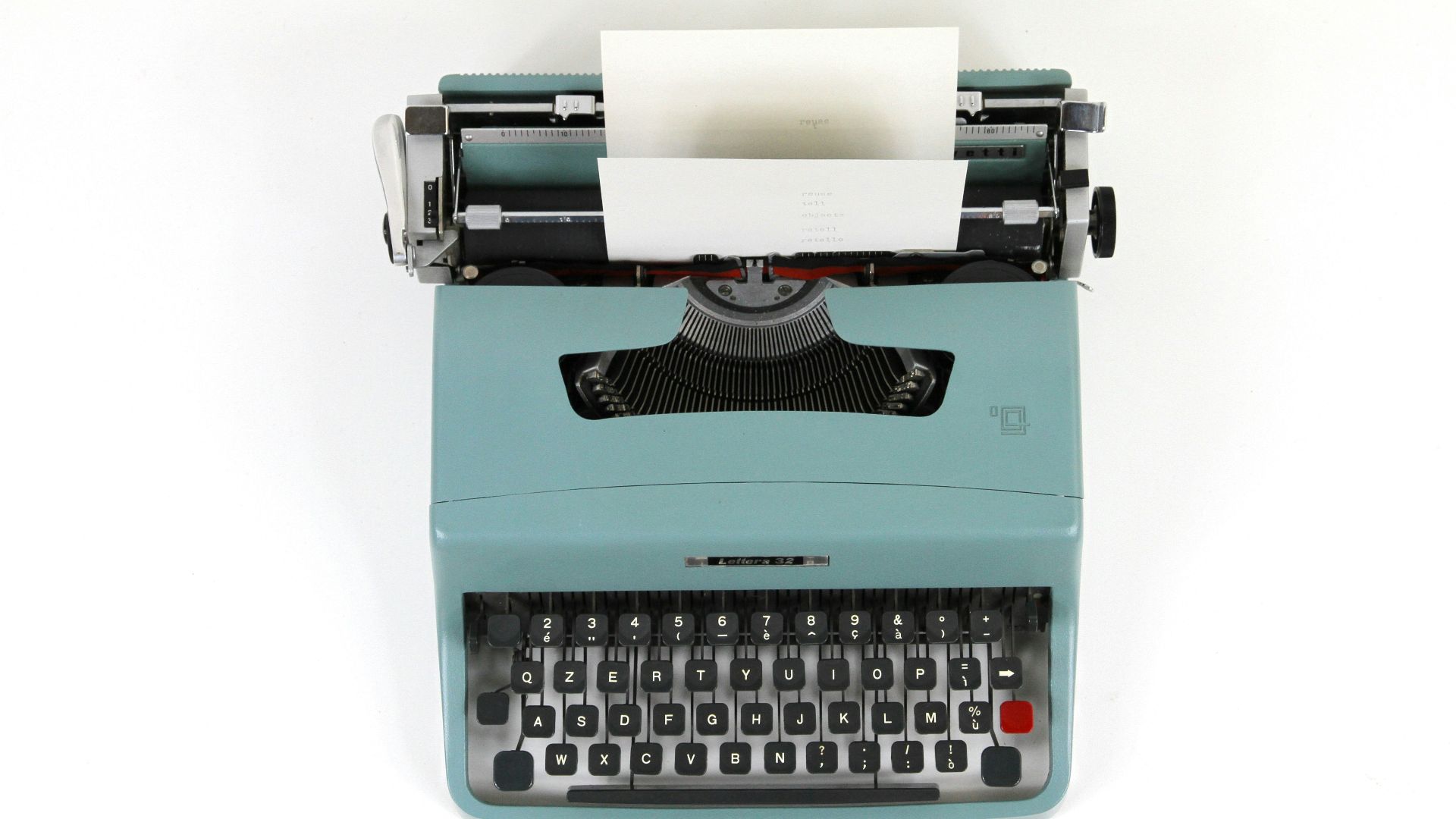 teal and black typewriter machine
