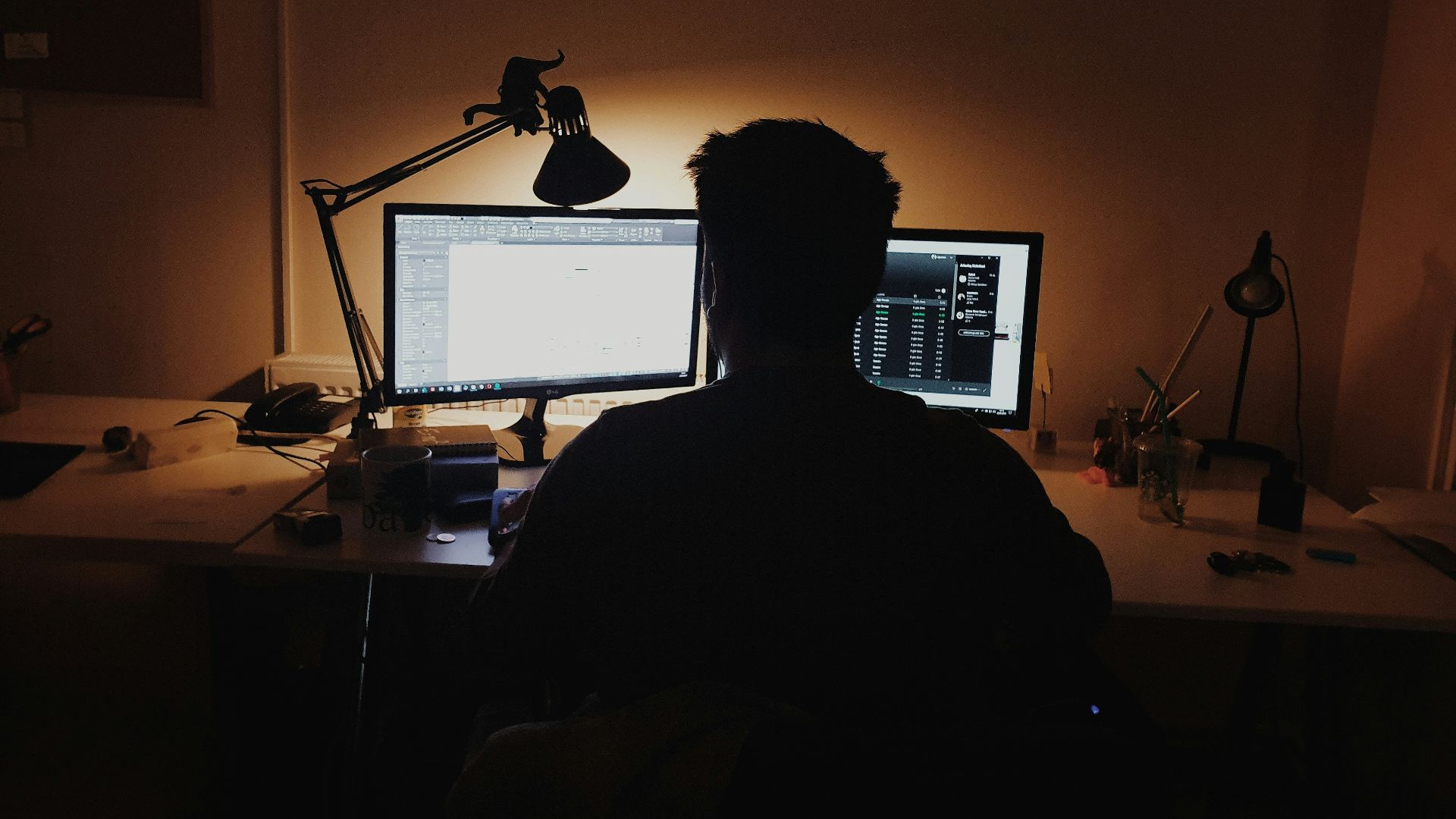 man using computer inside room