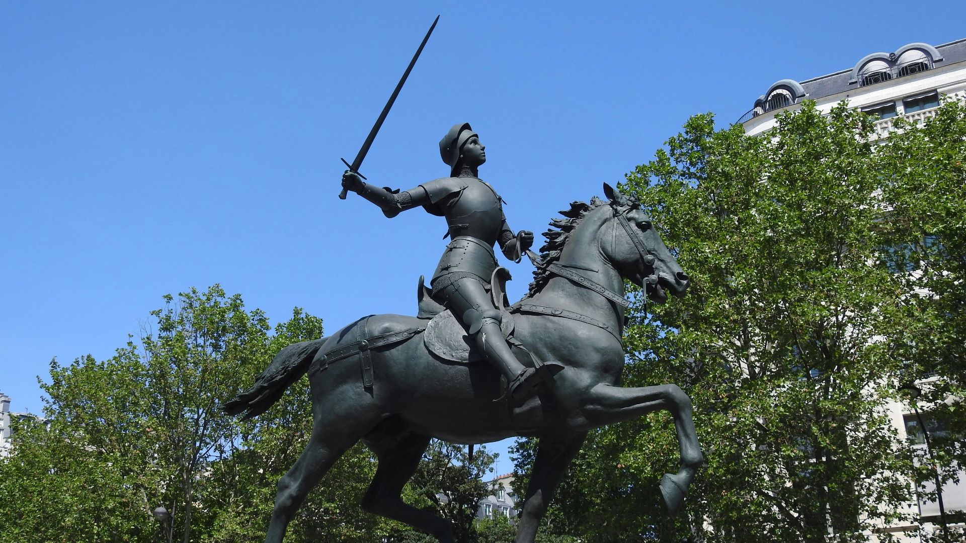 a statue of a man on a horse holding a sword