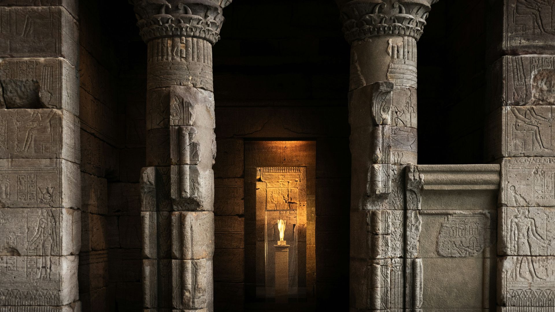 a couple of stone pillars in a building