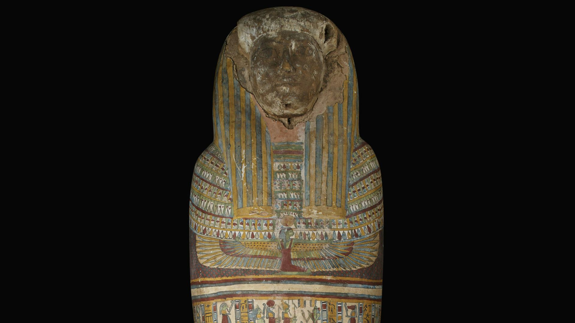 an egyptian statue of an egyptian god on a black background