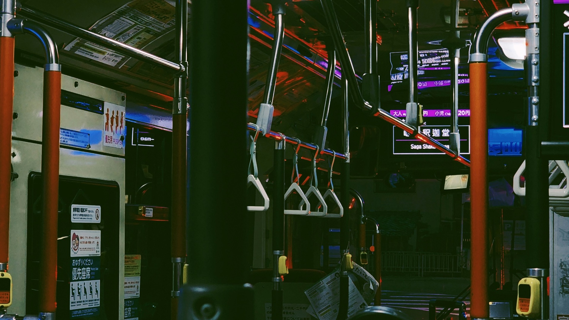 The interior of a public transit bus at night