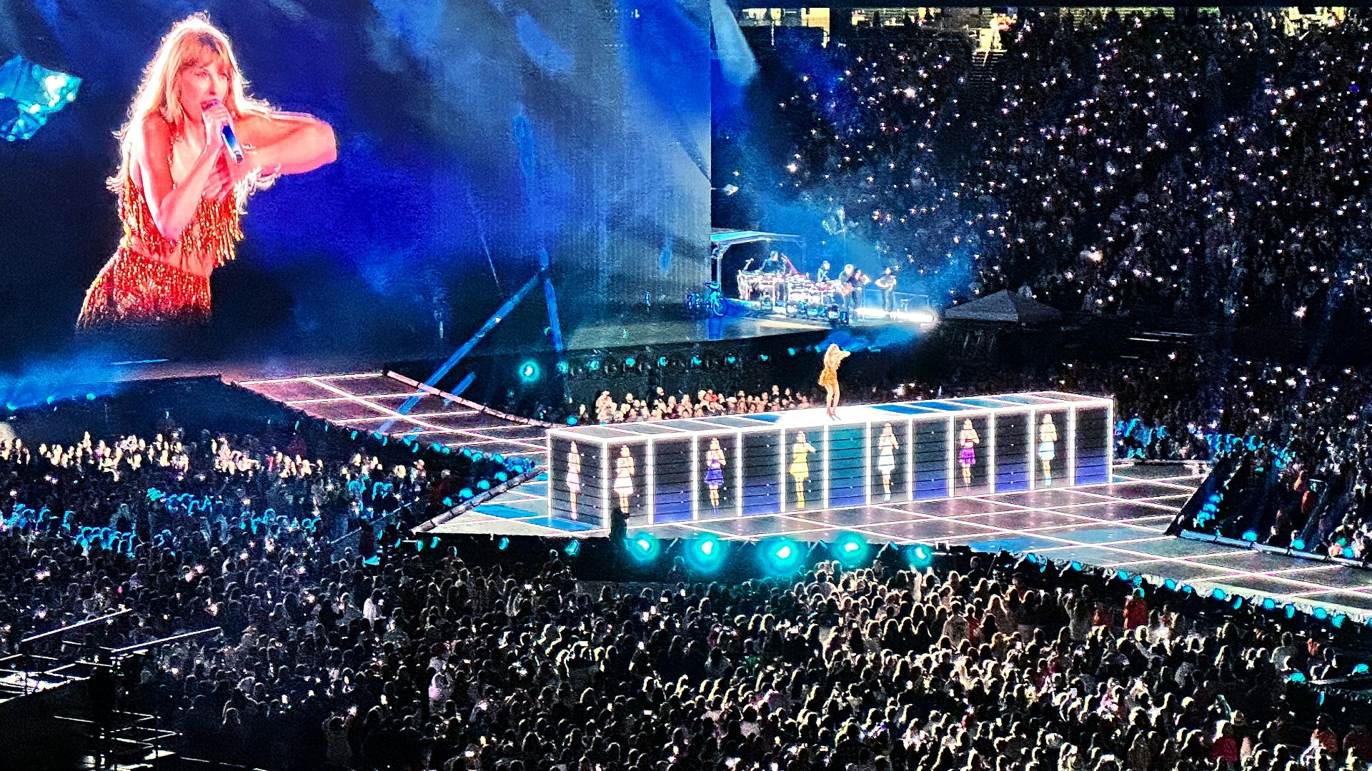 a crowd of people watching a woman on a stage
