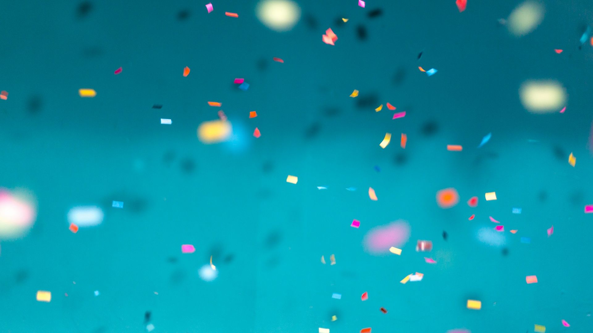 selective focus photography of multicolored confetti lot