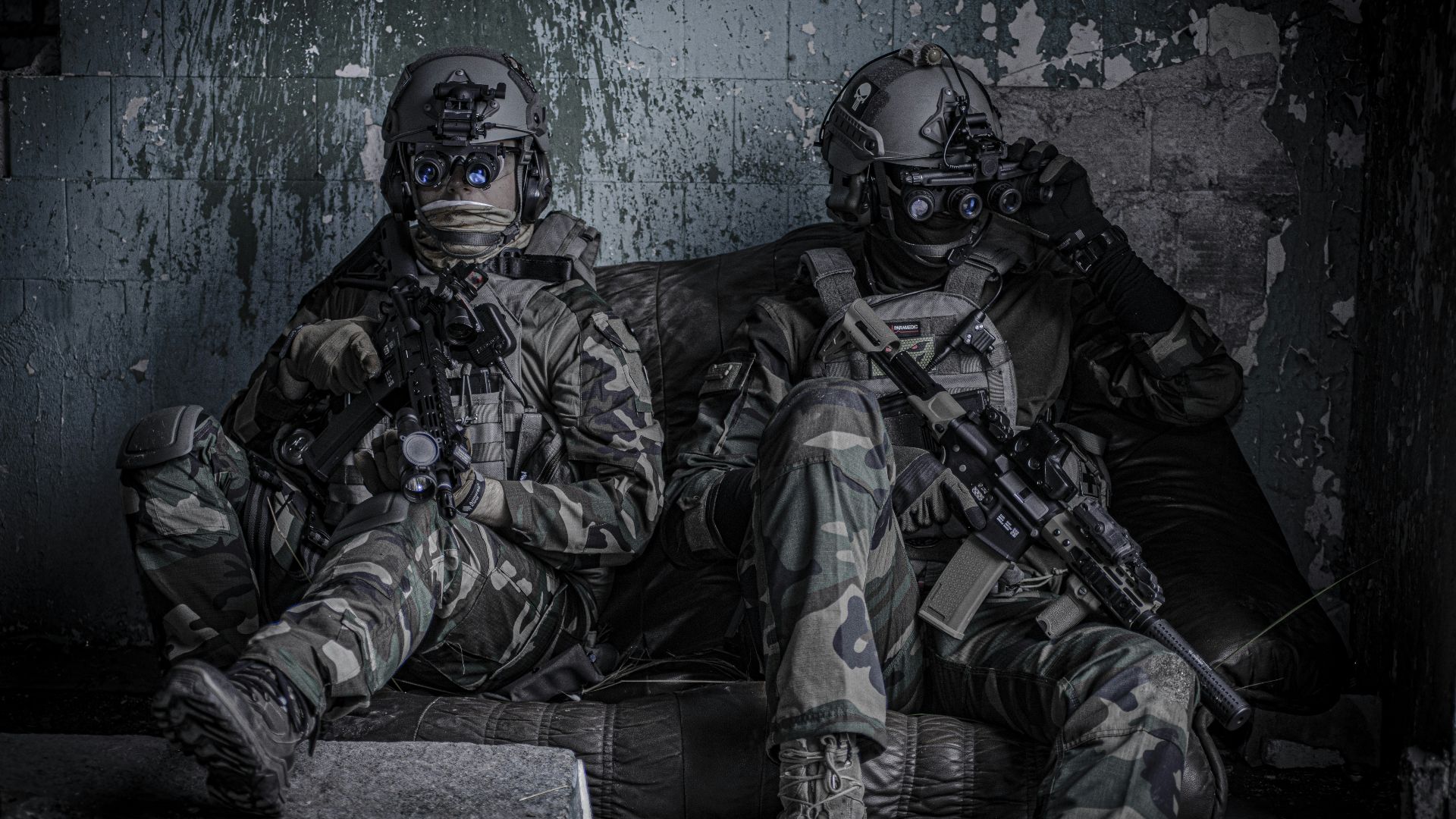 two officers sitting on sofa