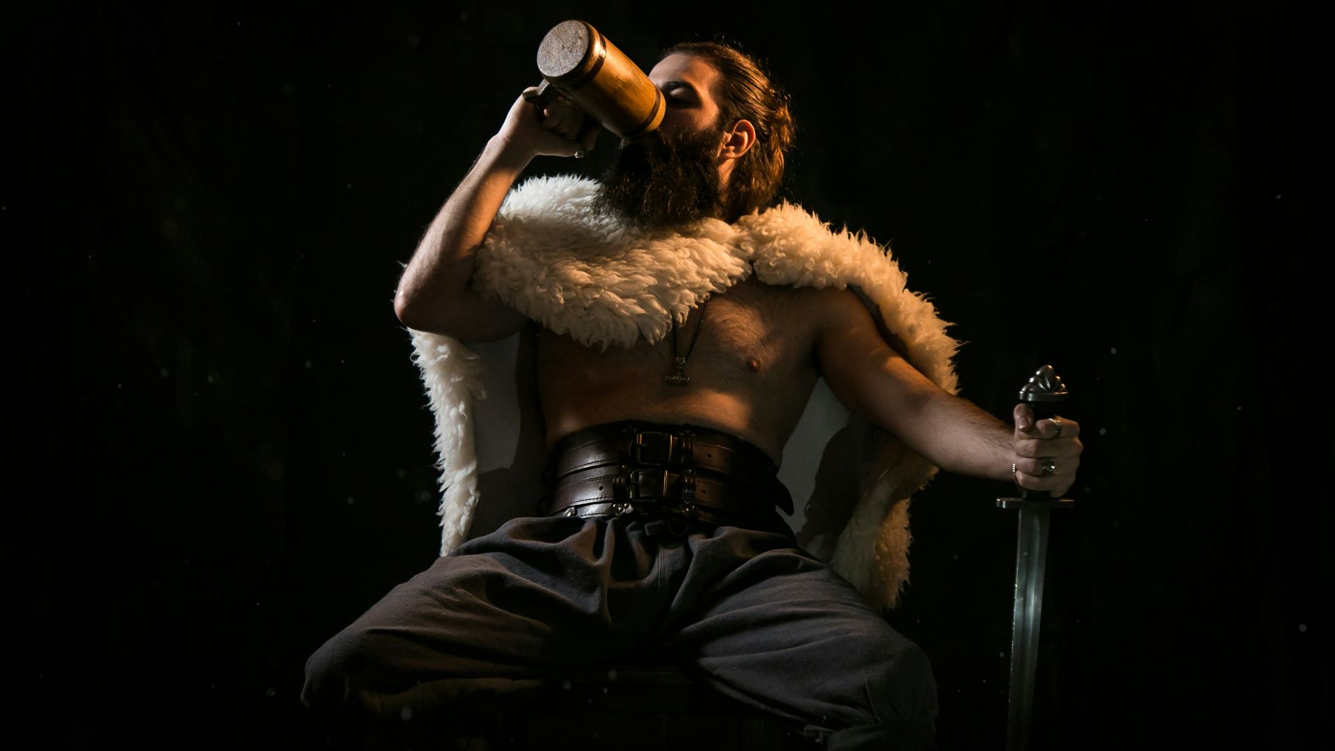 woman in white fur coat holding black microphone