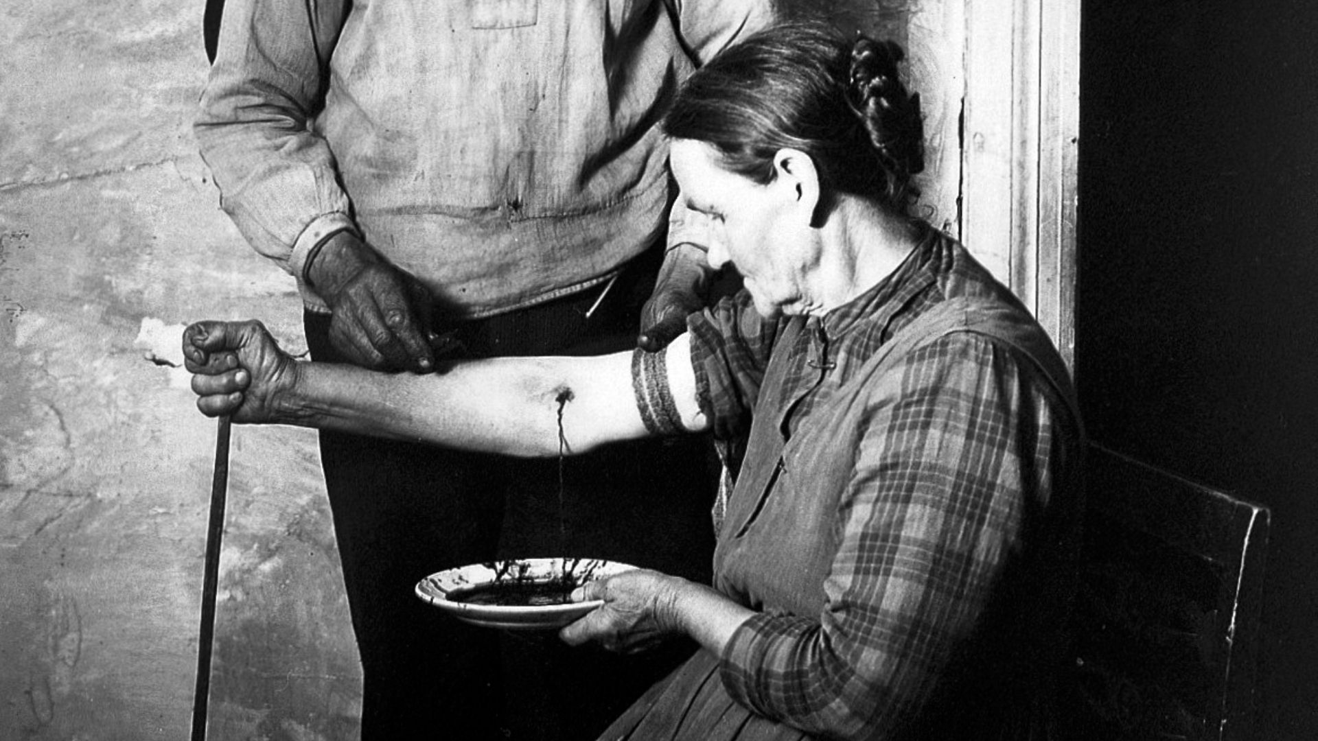 File:Bloodletting scene by N. Keyland, 1922 Wellcome L0016600.jpg