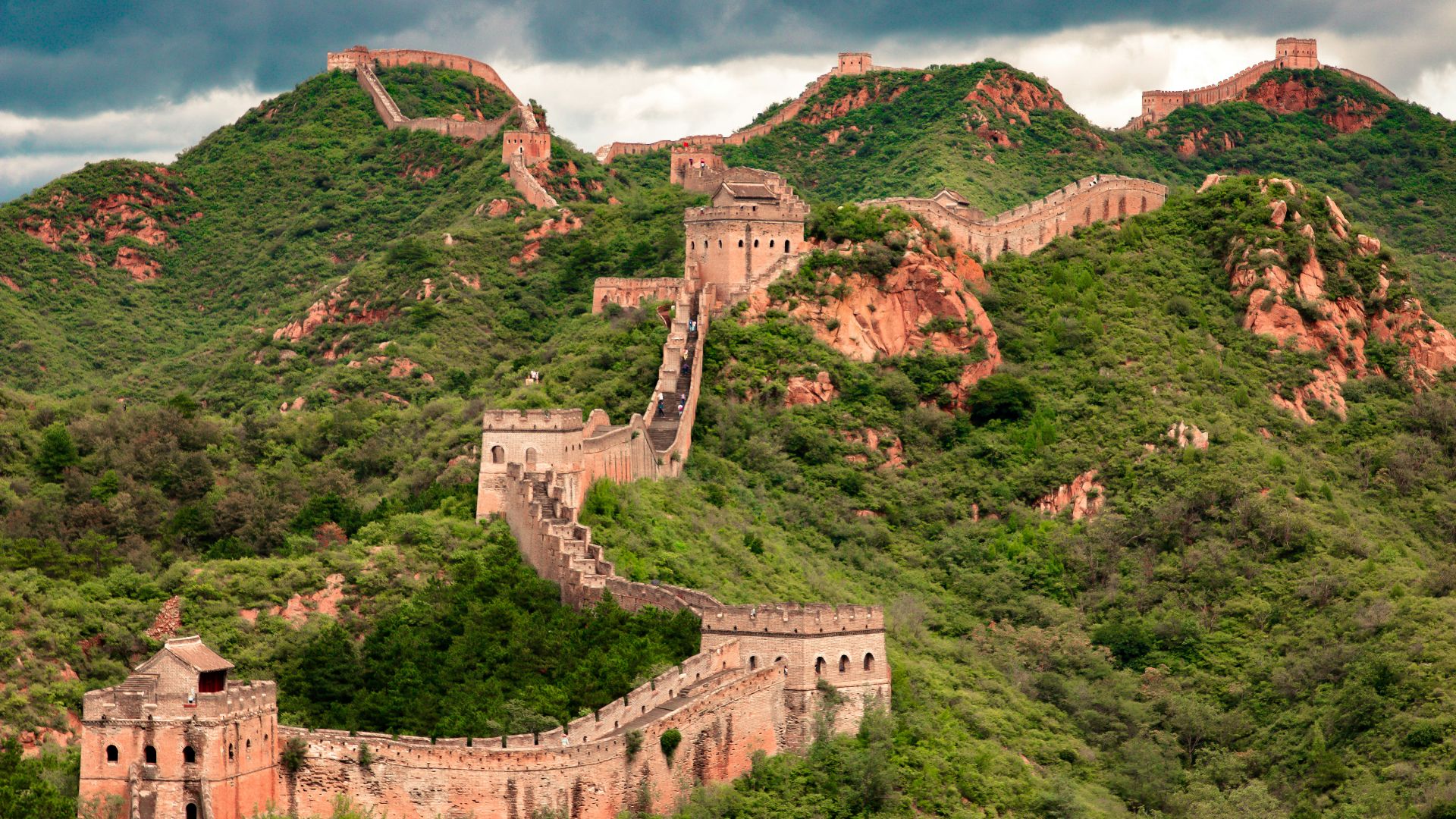 brown concrete building on top of hill