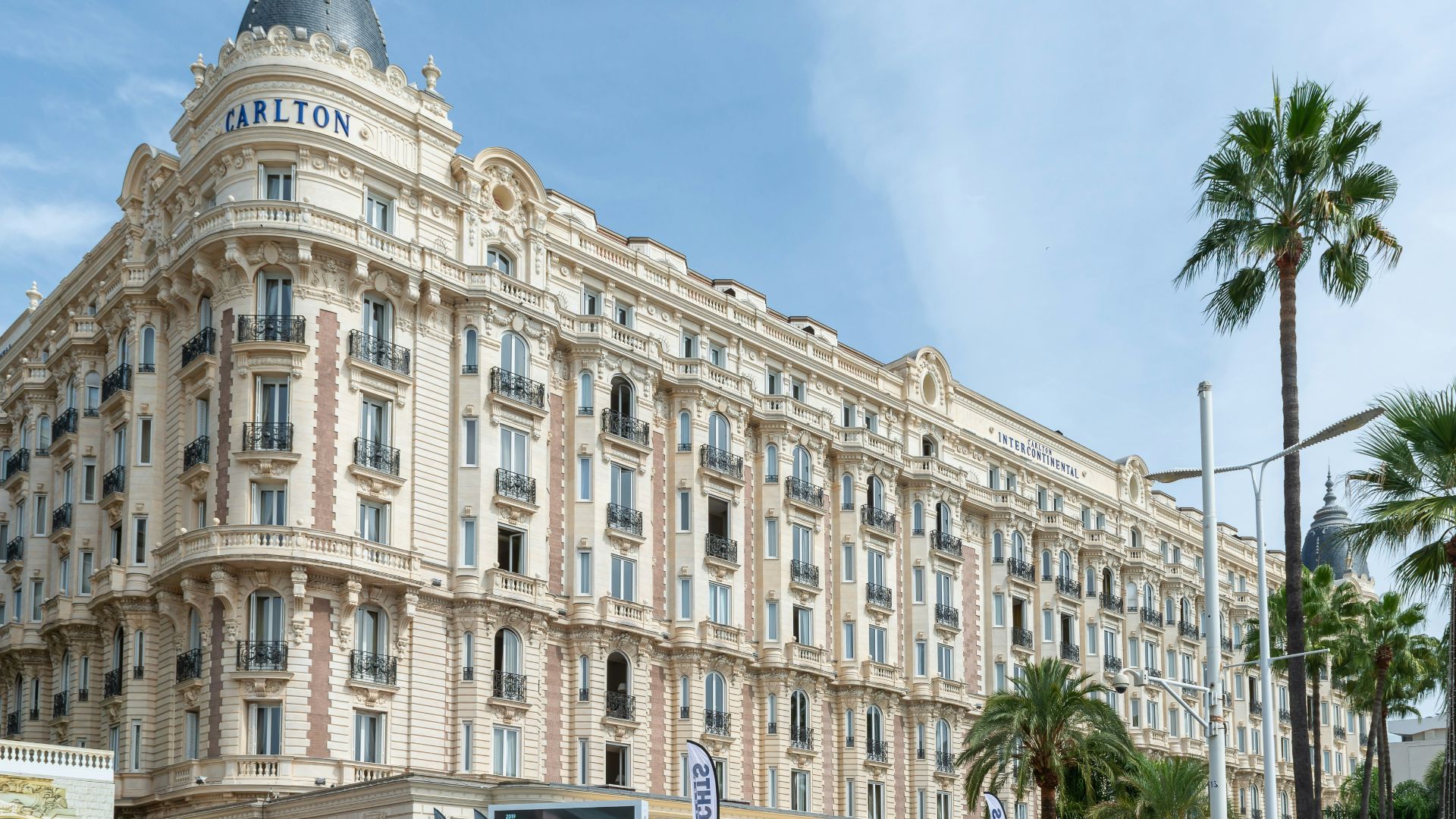 a very tall building sitting on the side of a road