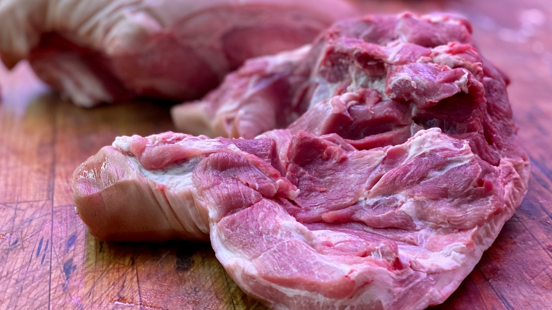 raw meat on brown wooden table