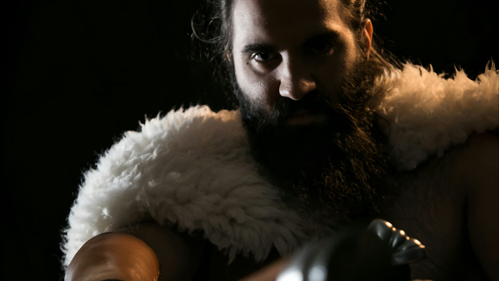 a man with a sword and a beard