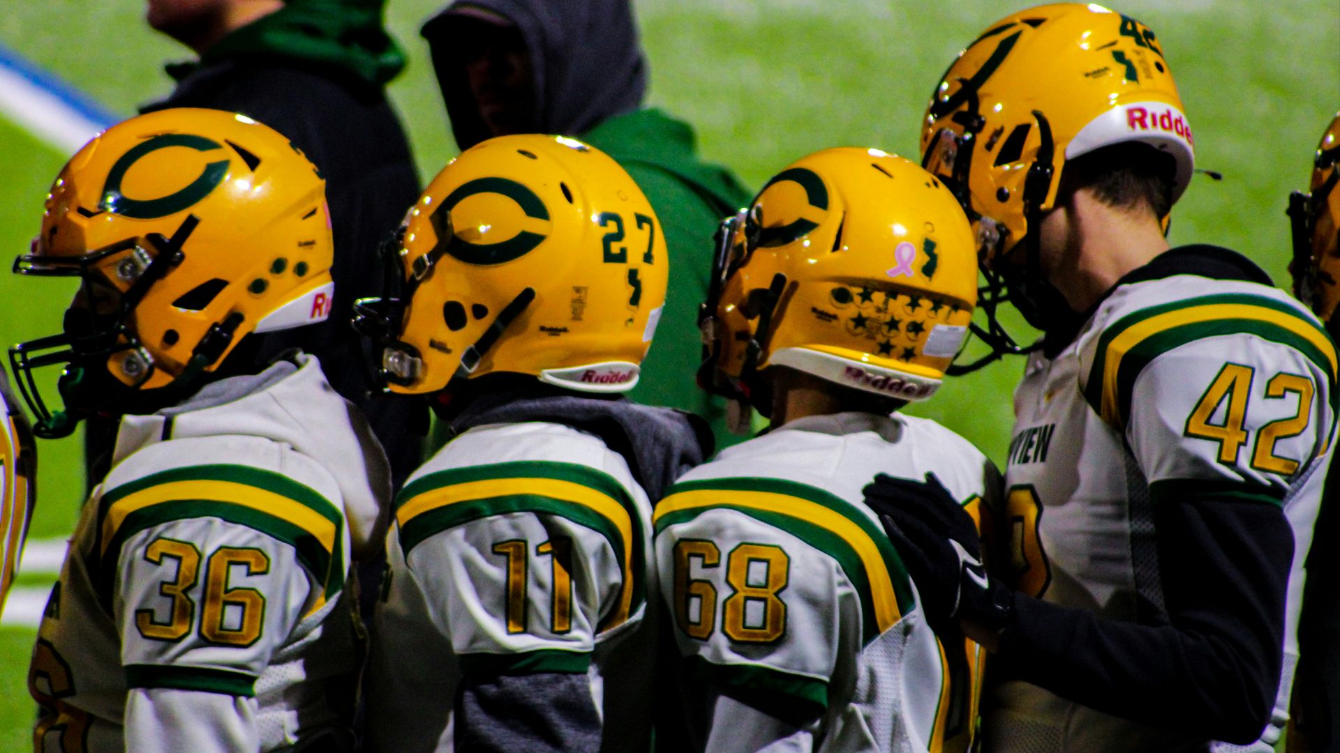 a group of football players standing next to each other