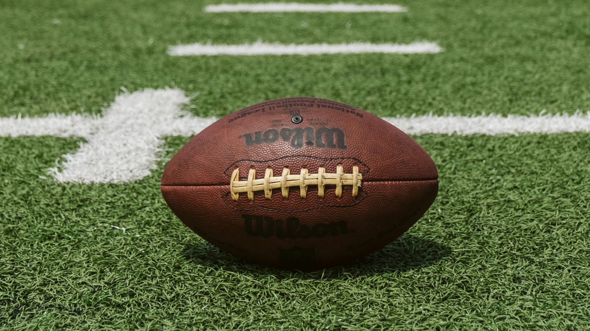 brown and black Wilson football