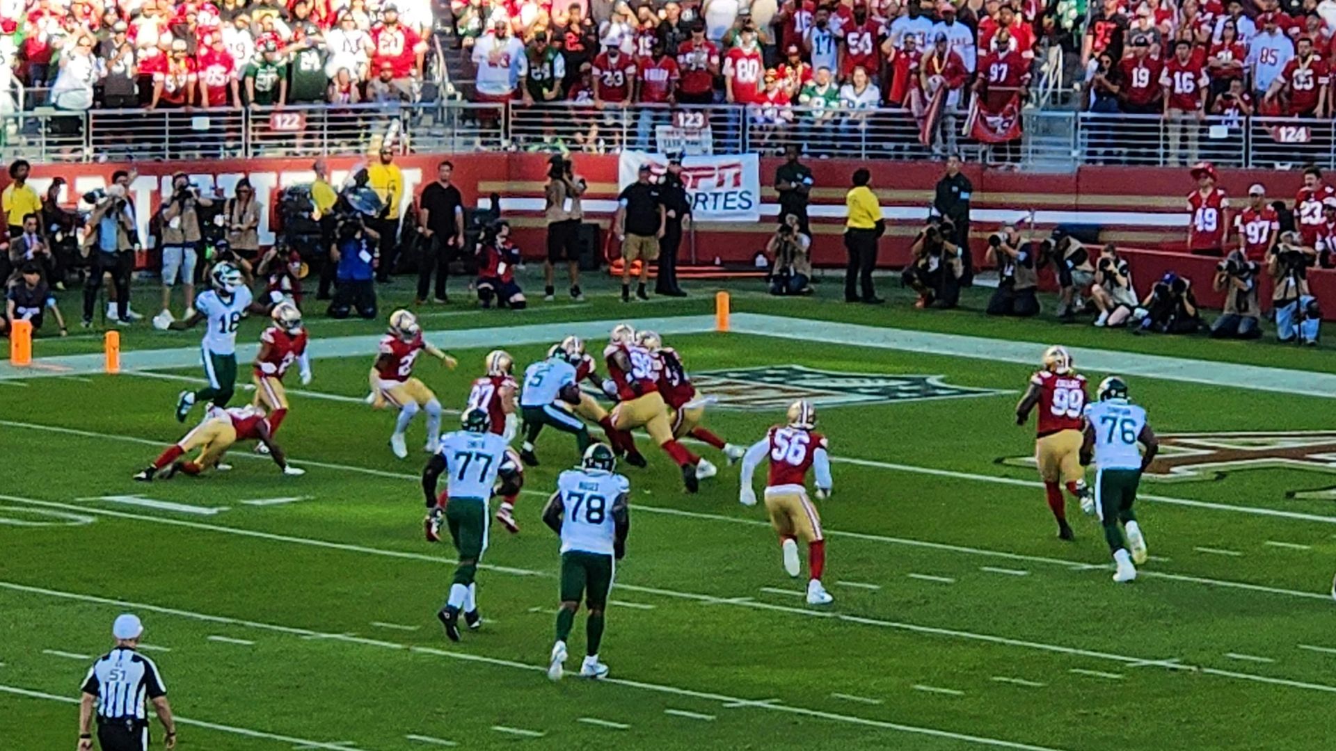 A football game is being played in a stadium