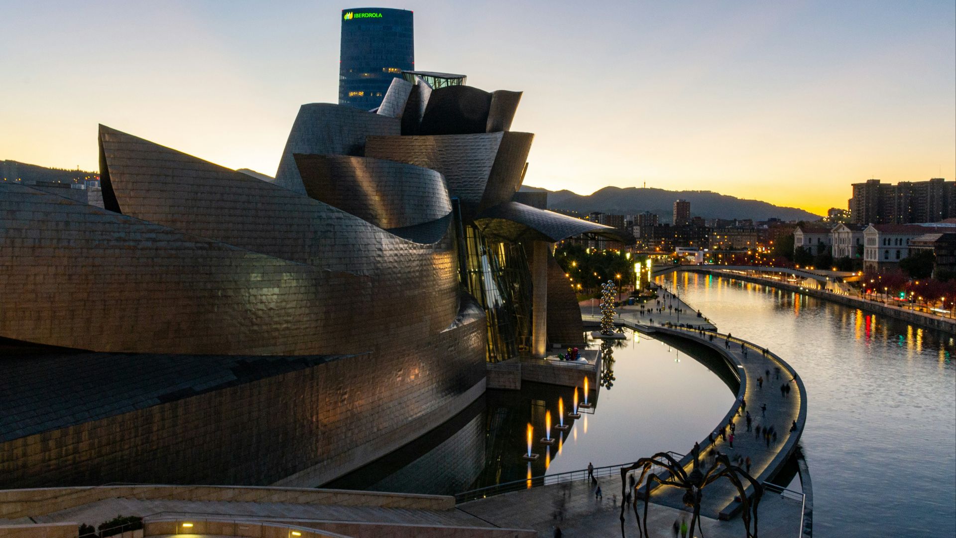 a view of a building next to a body of water