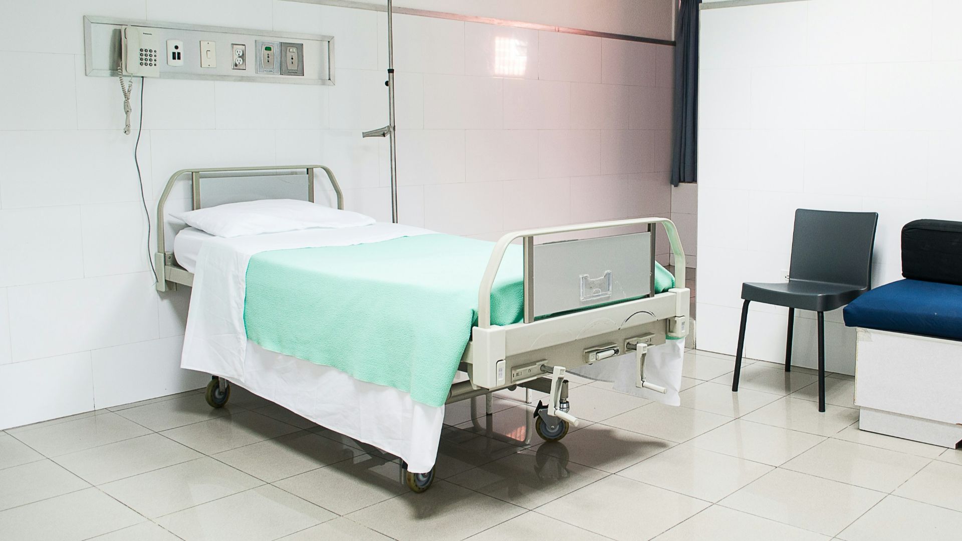 hospital bed near couch