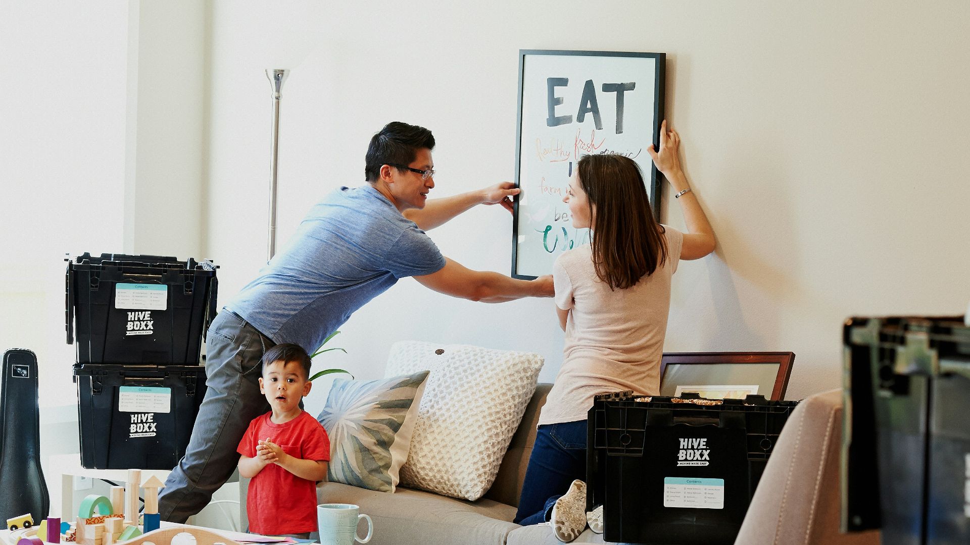 woman in blue denim jacket standing beside woman in black shirt