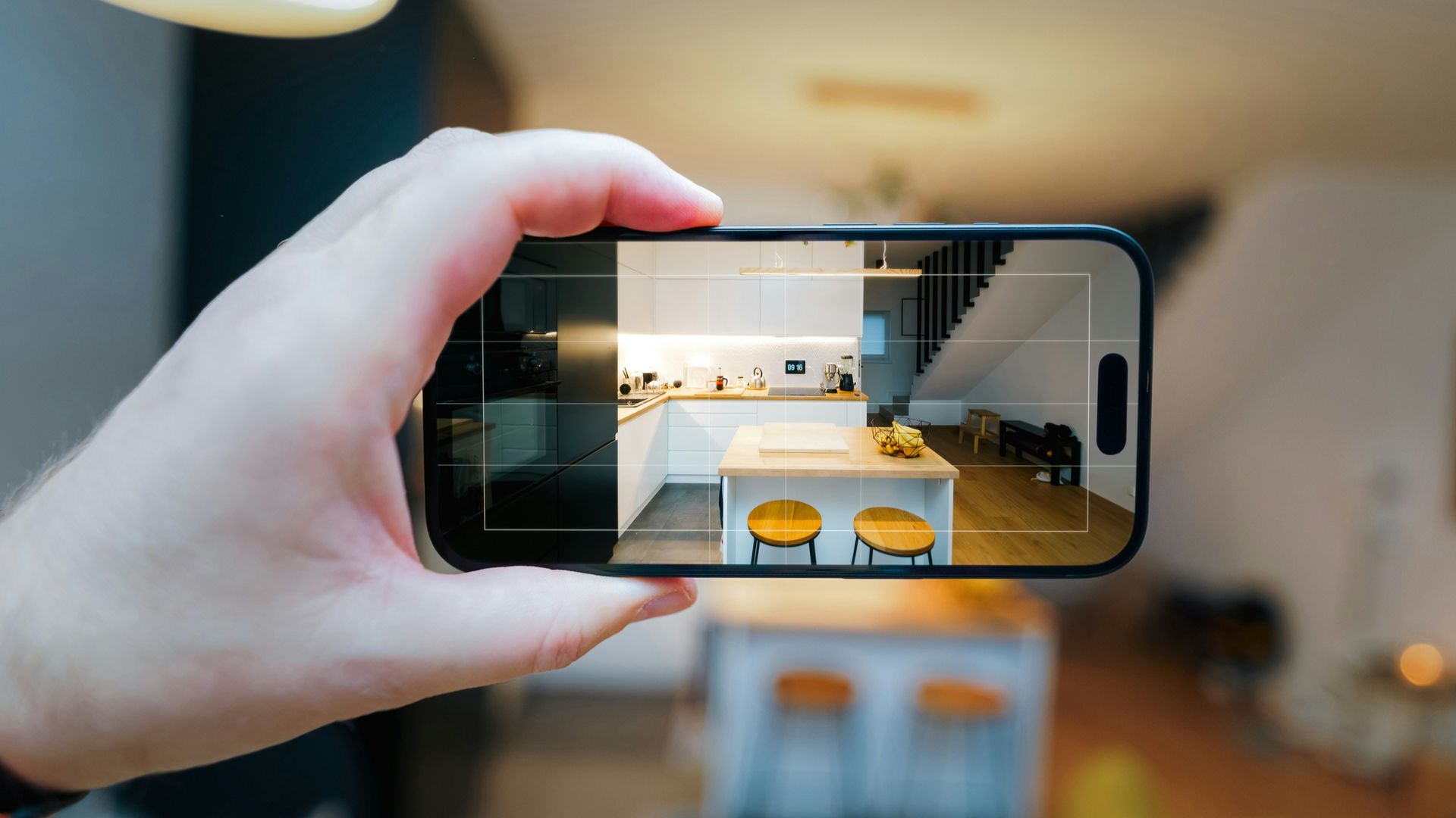 A person taking a picture of a living room