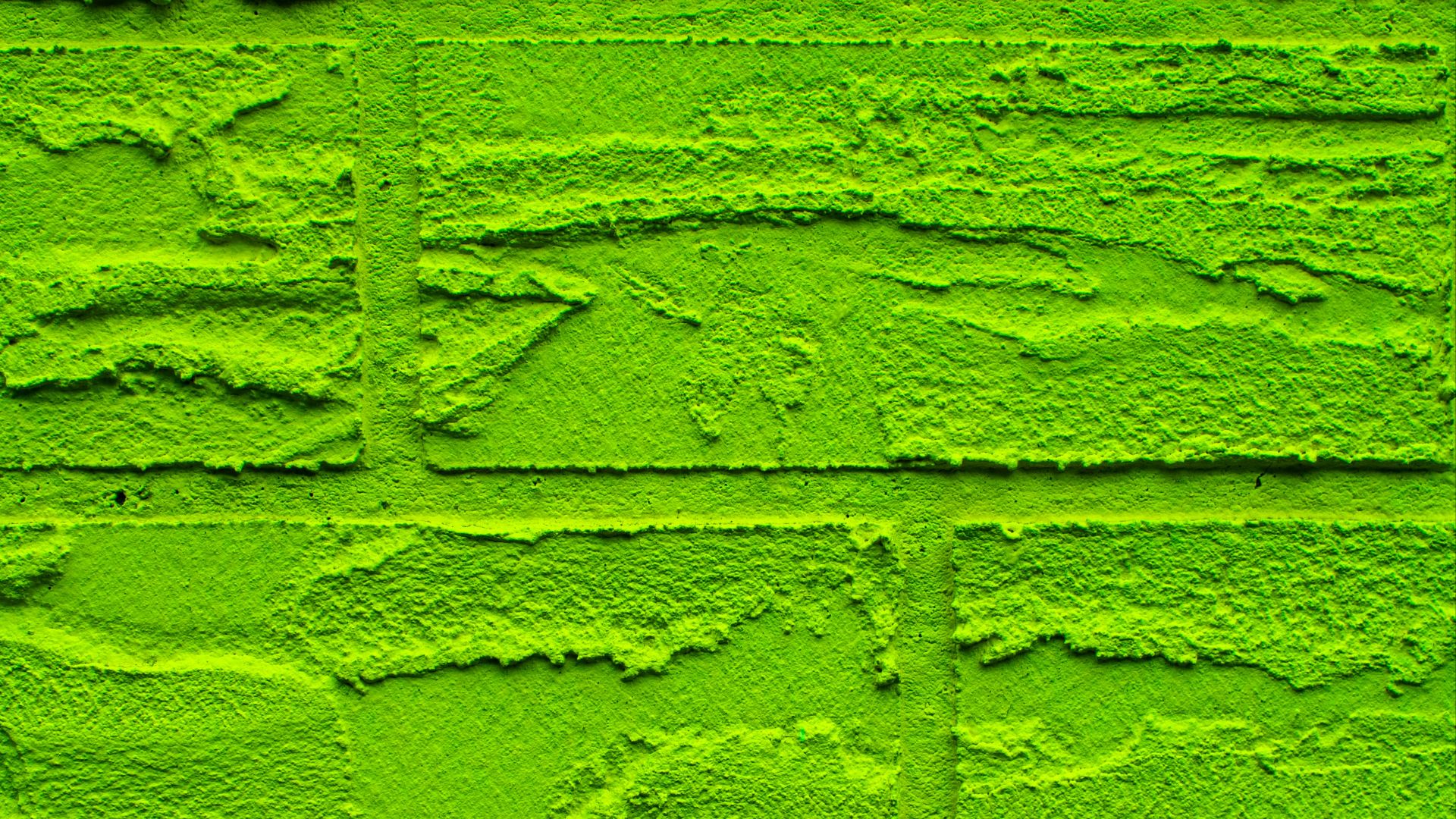 Bright green brick wall texture.