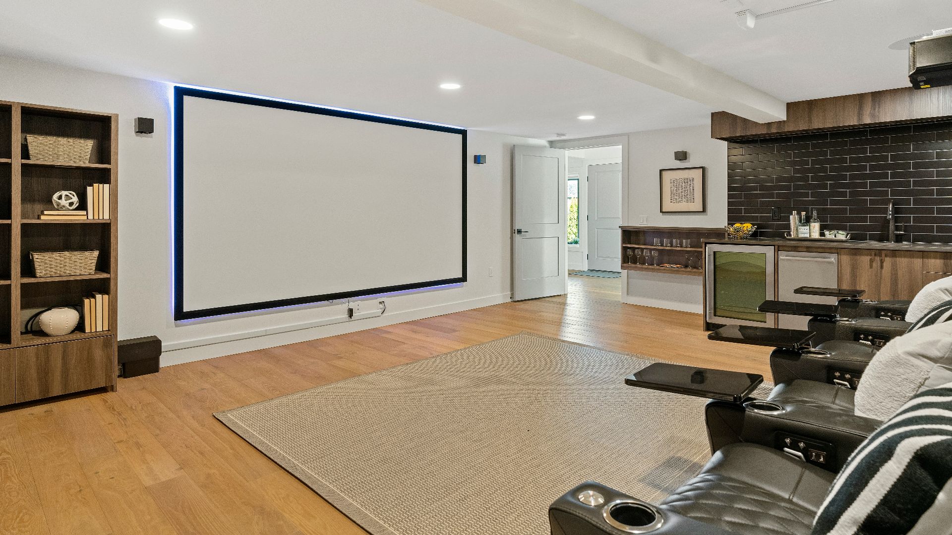 a living room with a large projection screen