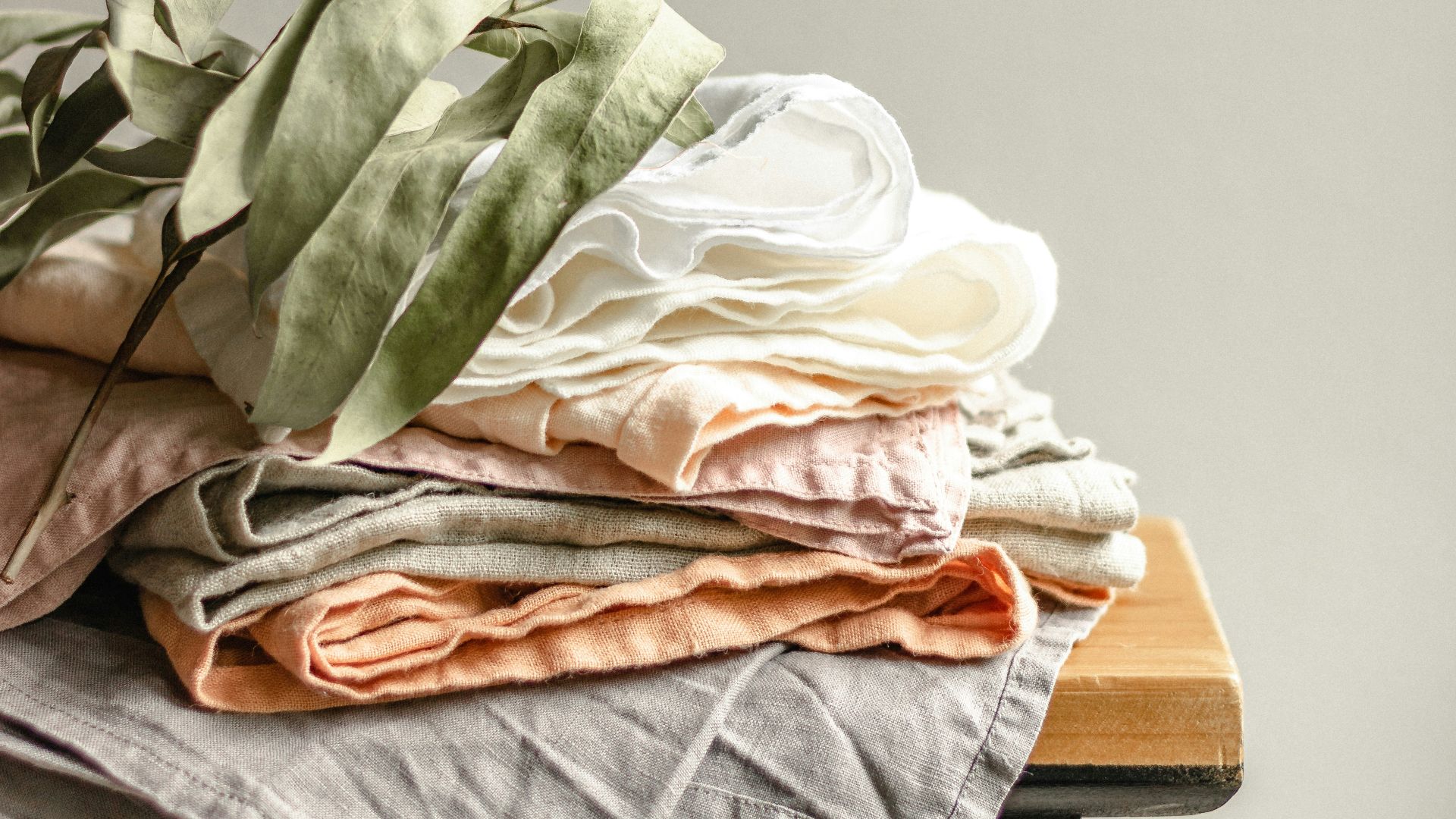green and white textile on brown wooden board