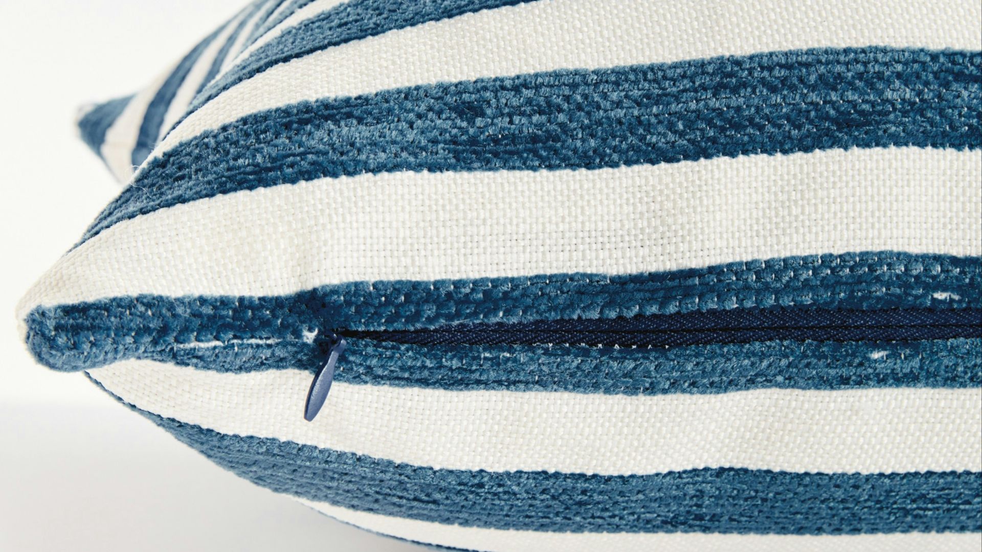 Close up of a blue and white striped pillow