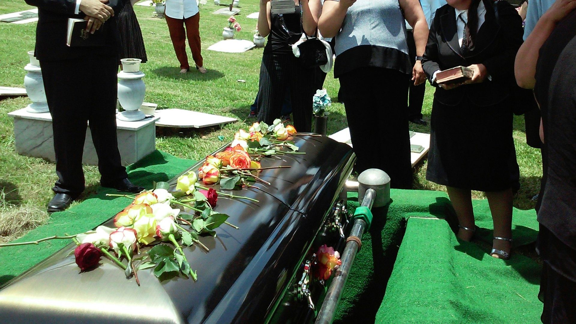 group of people attending burial