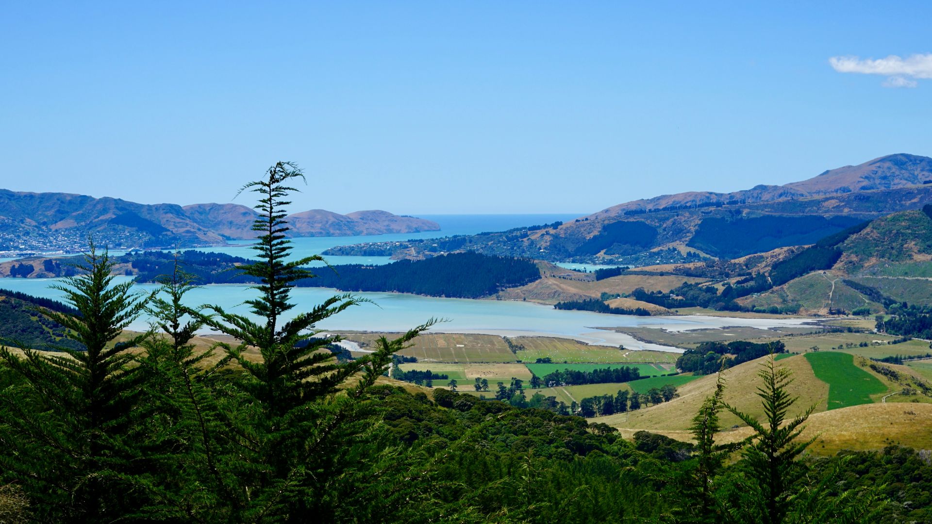 a scenic view of a lake and mountains