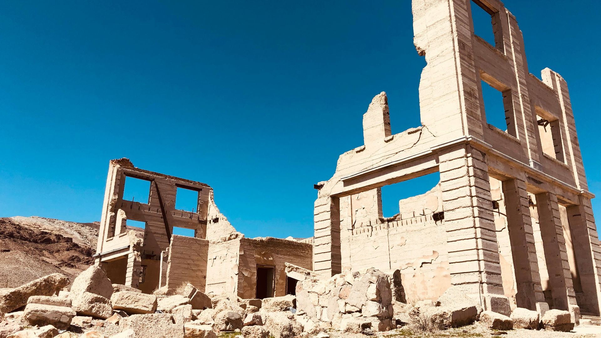 brown concrete building under blue sky during daytime