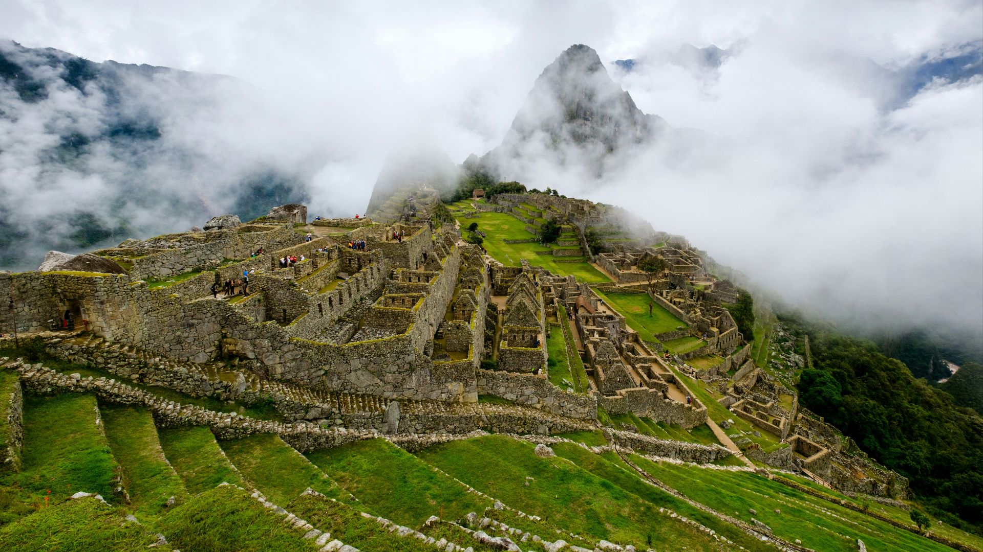 a view of the ruins of a mountain in the clouds