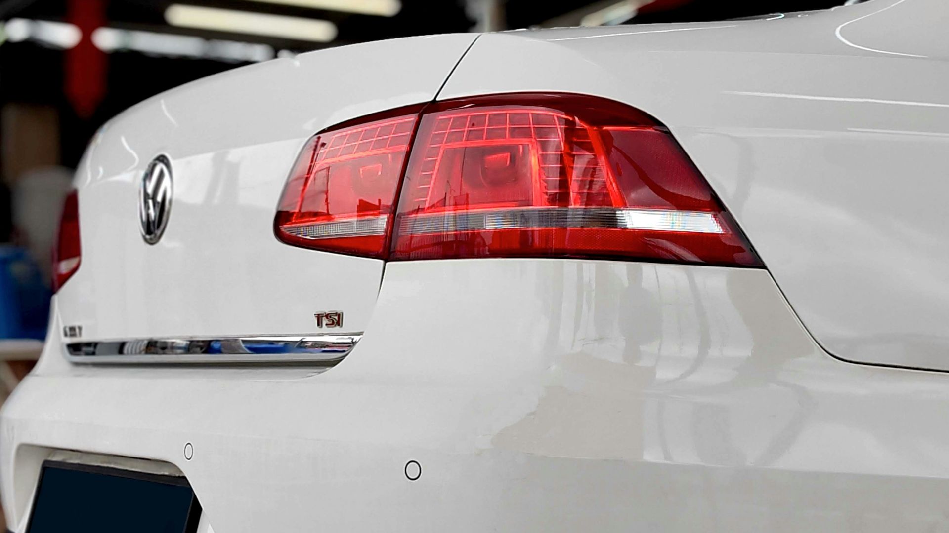 a white car is parked in a garage