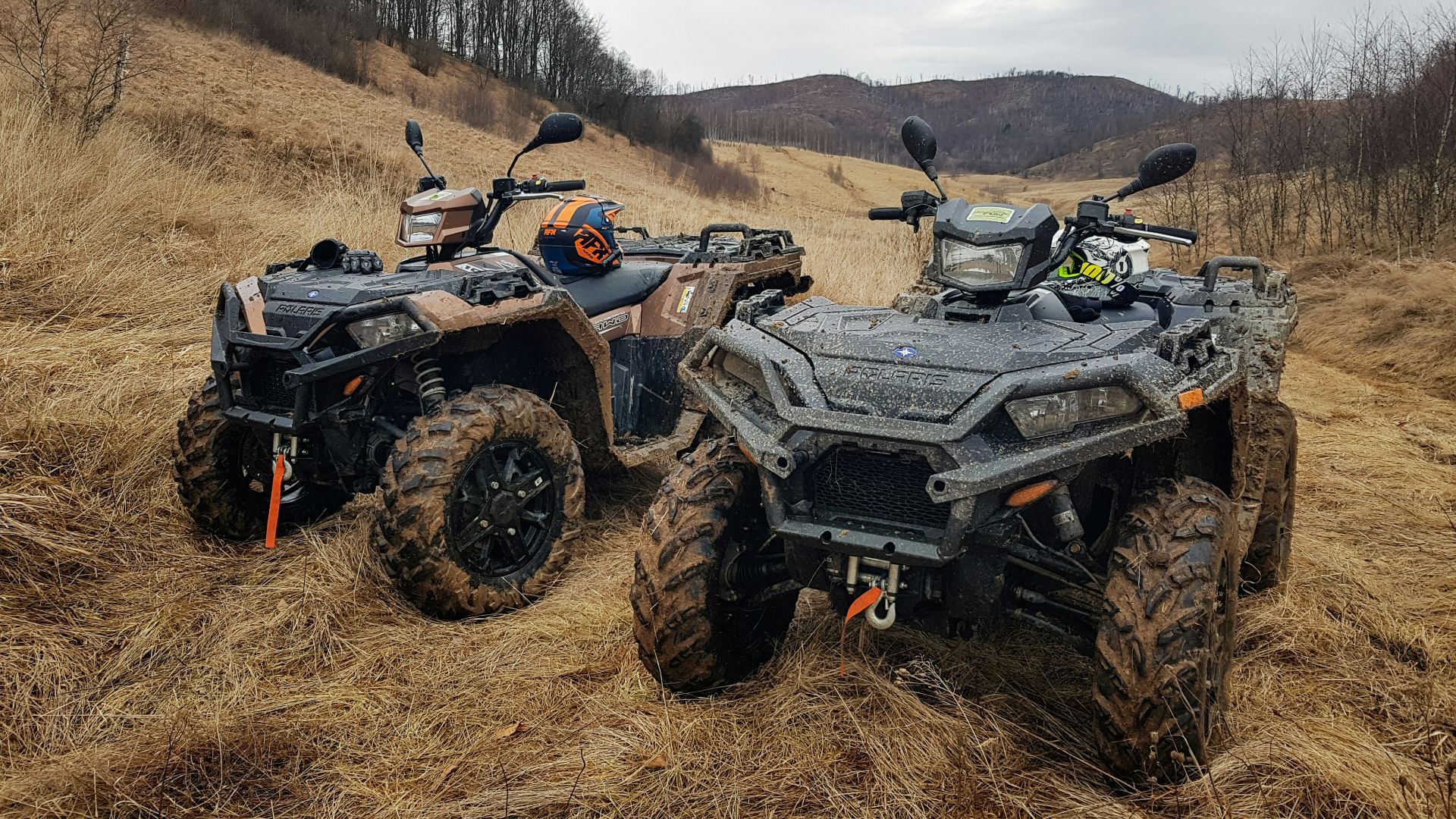 black and gray atv on brown field during daytime