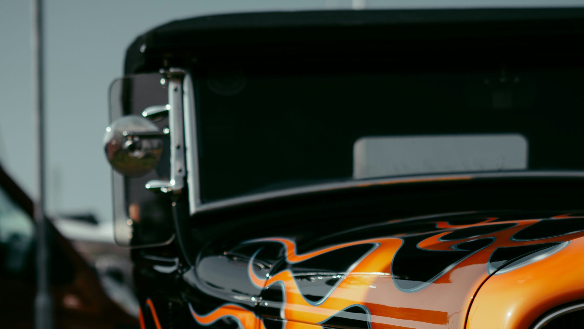 a yellow car with a black rim