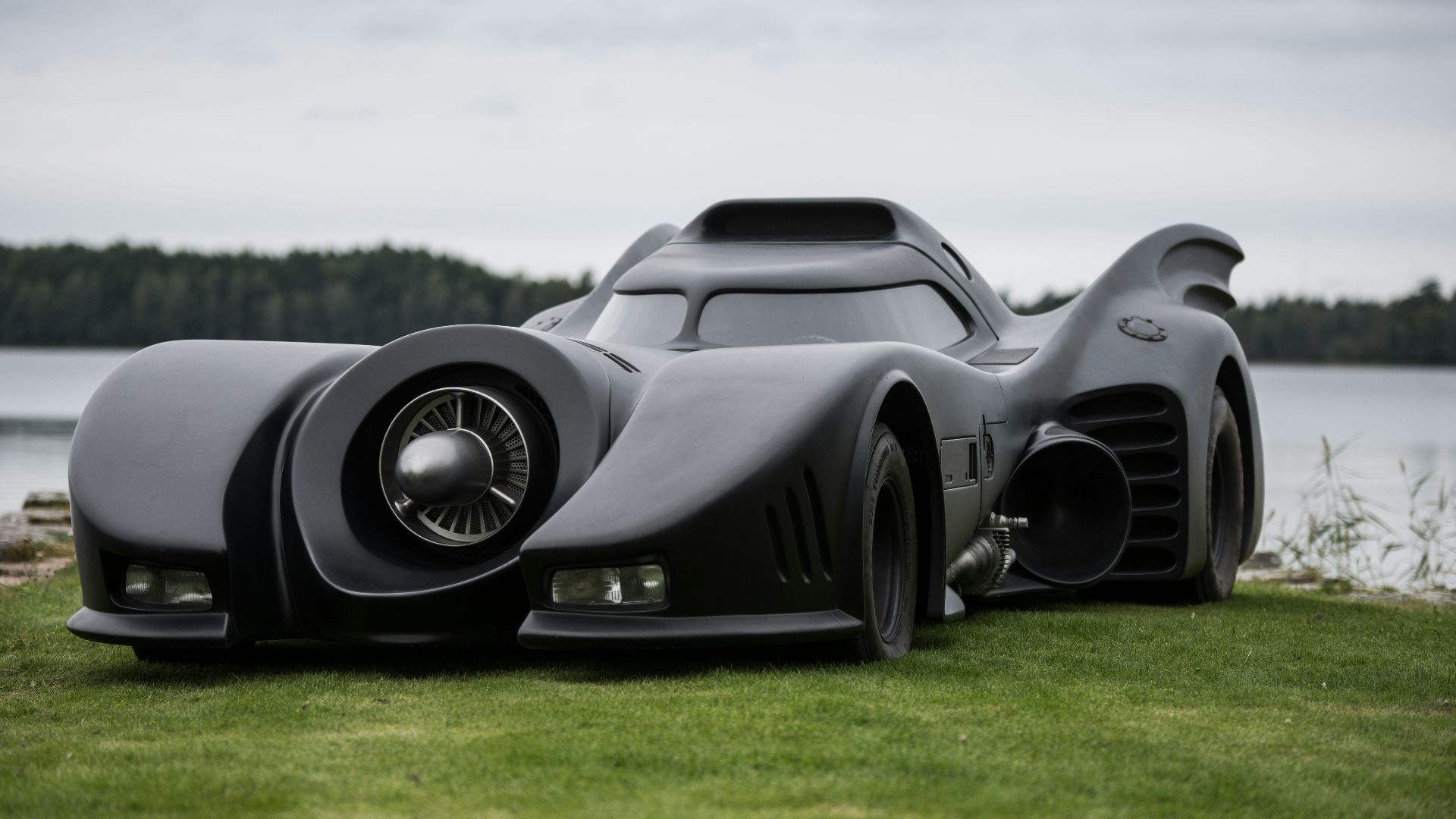 a car that is sitting in the grass