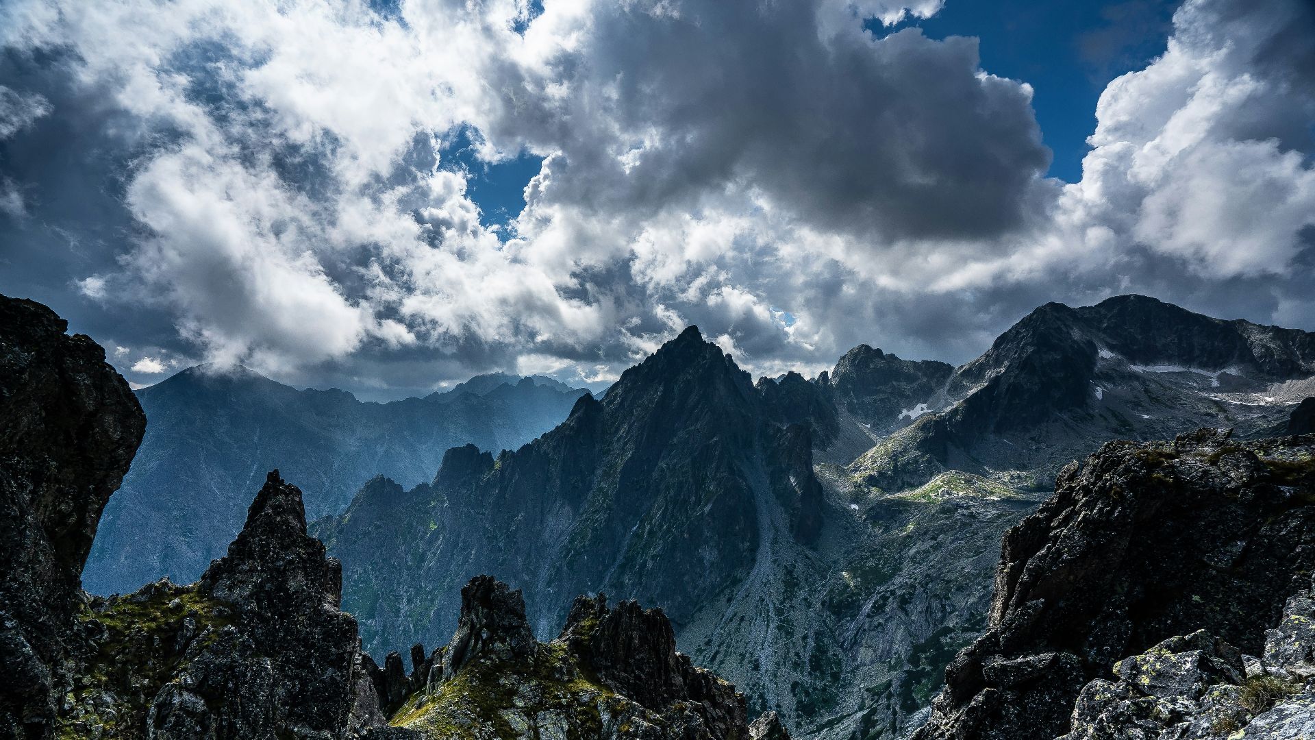 green and brown mountain under white clouds during daytime