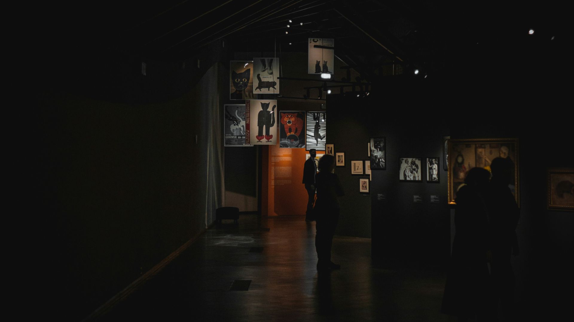 a group of people standing in a dark room