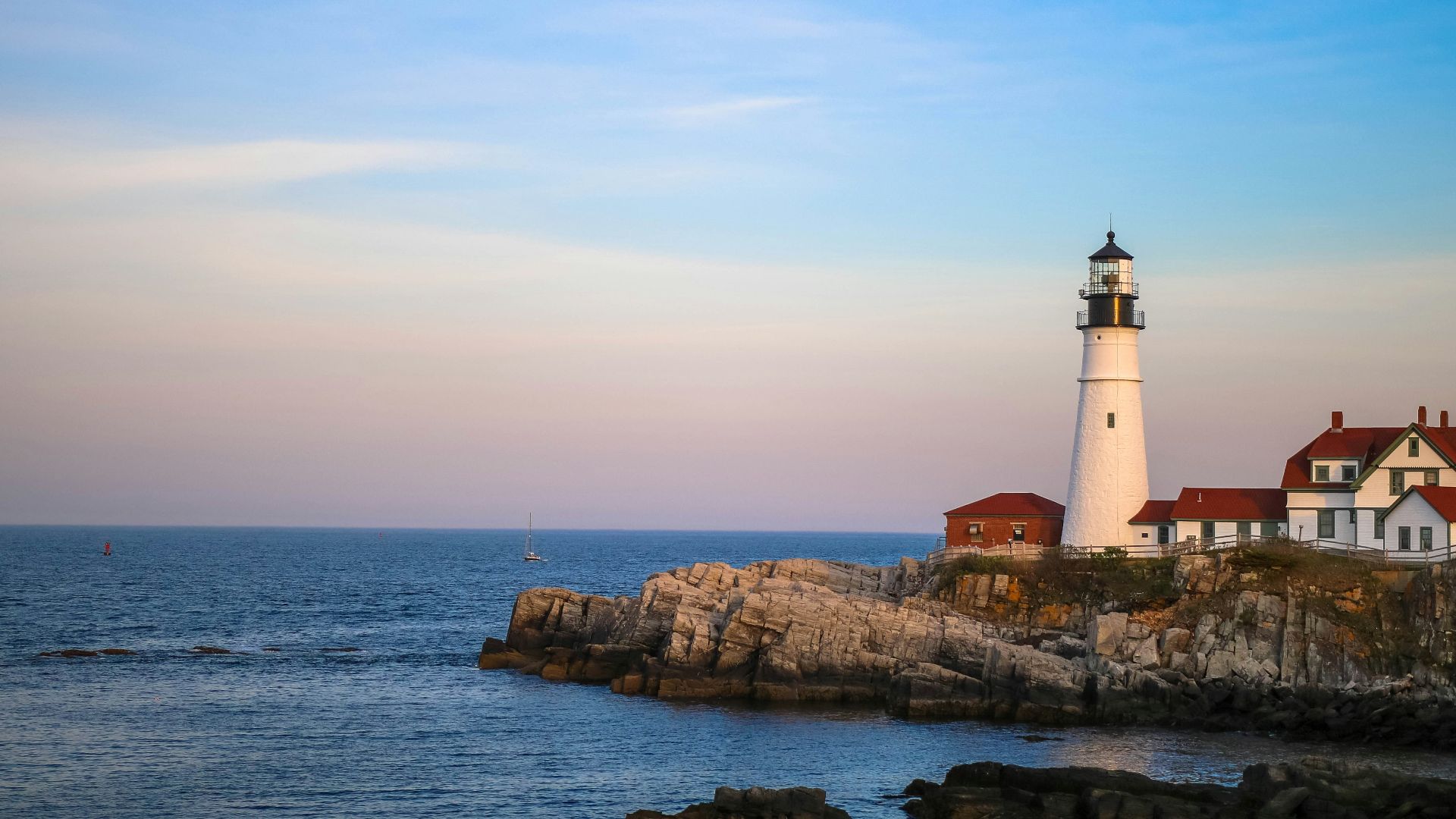 white lighthouse near body of water