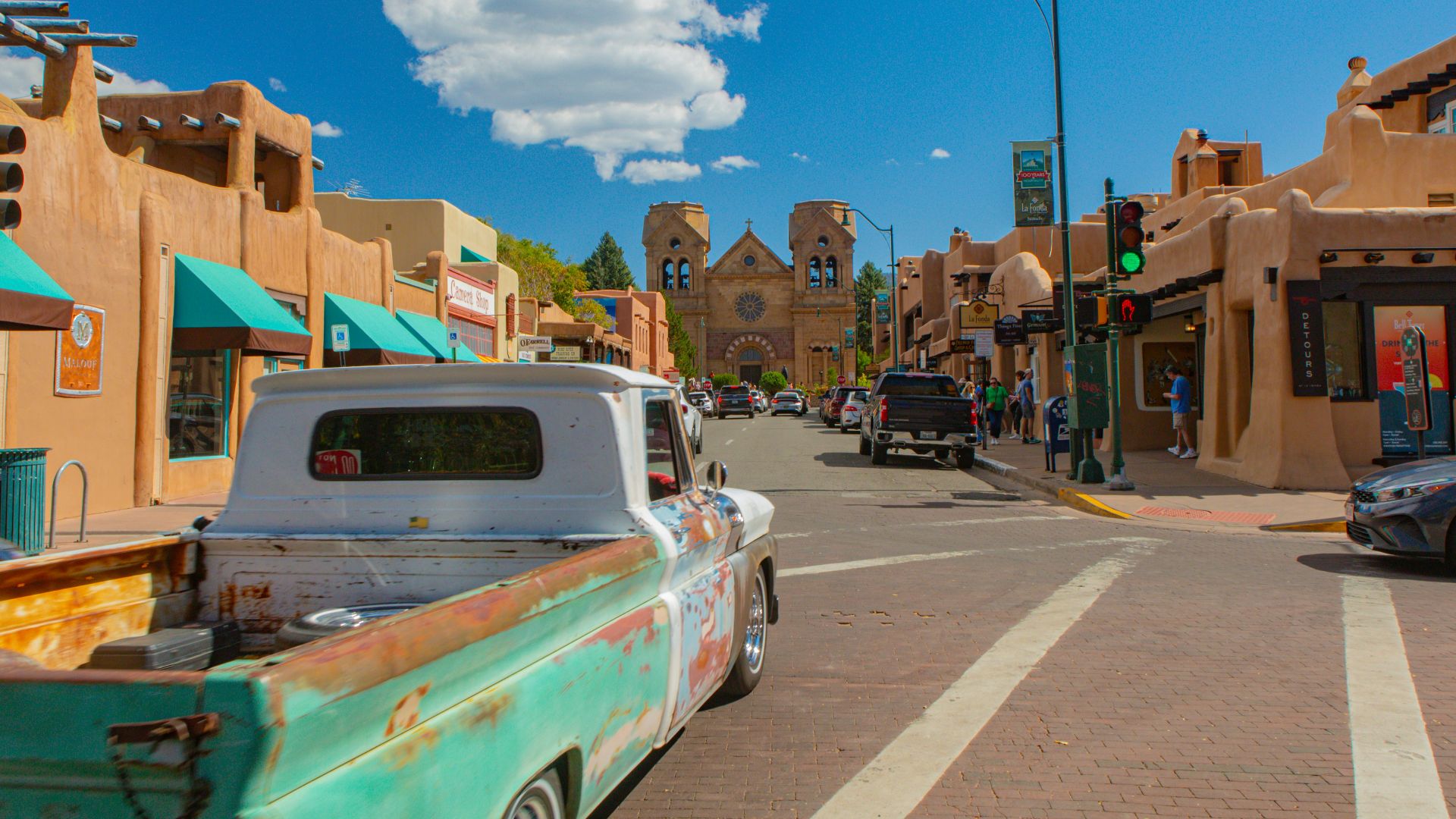 A street with cars parked on the side of it