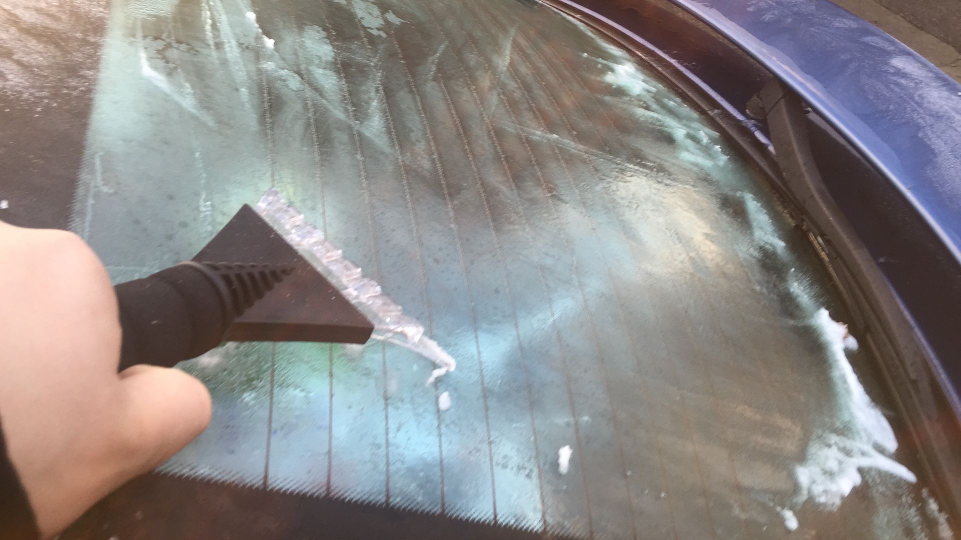 File:Ice scraper on a car window.JPG