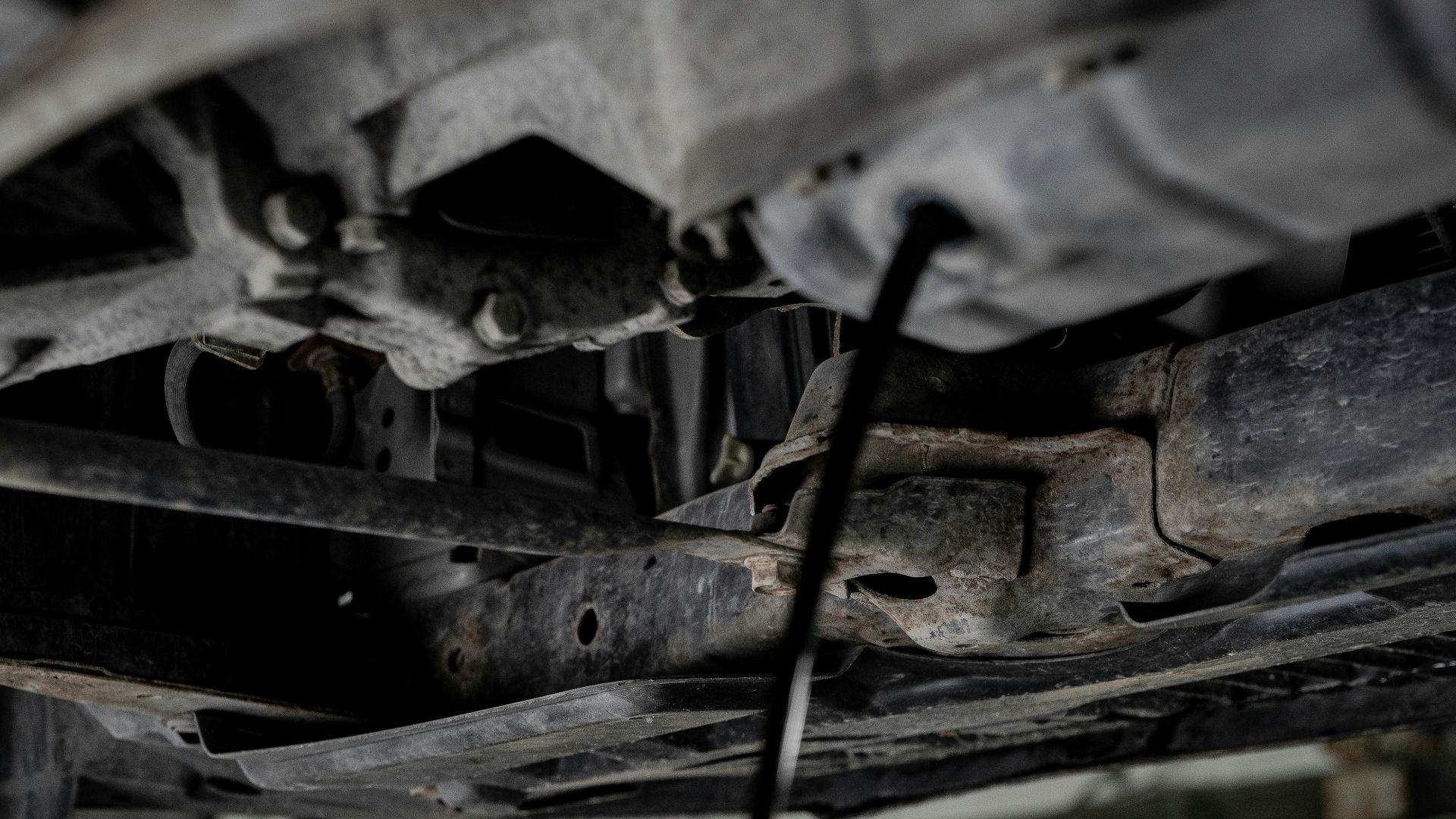 a man working on a car in a garage