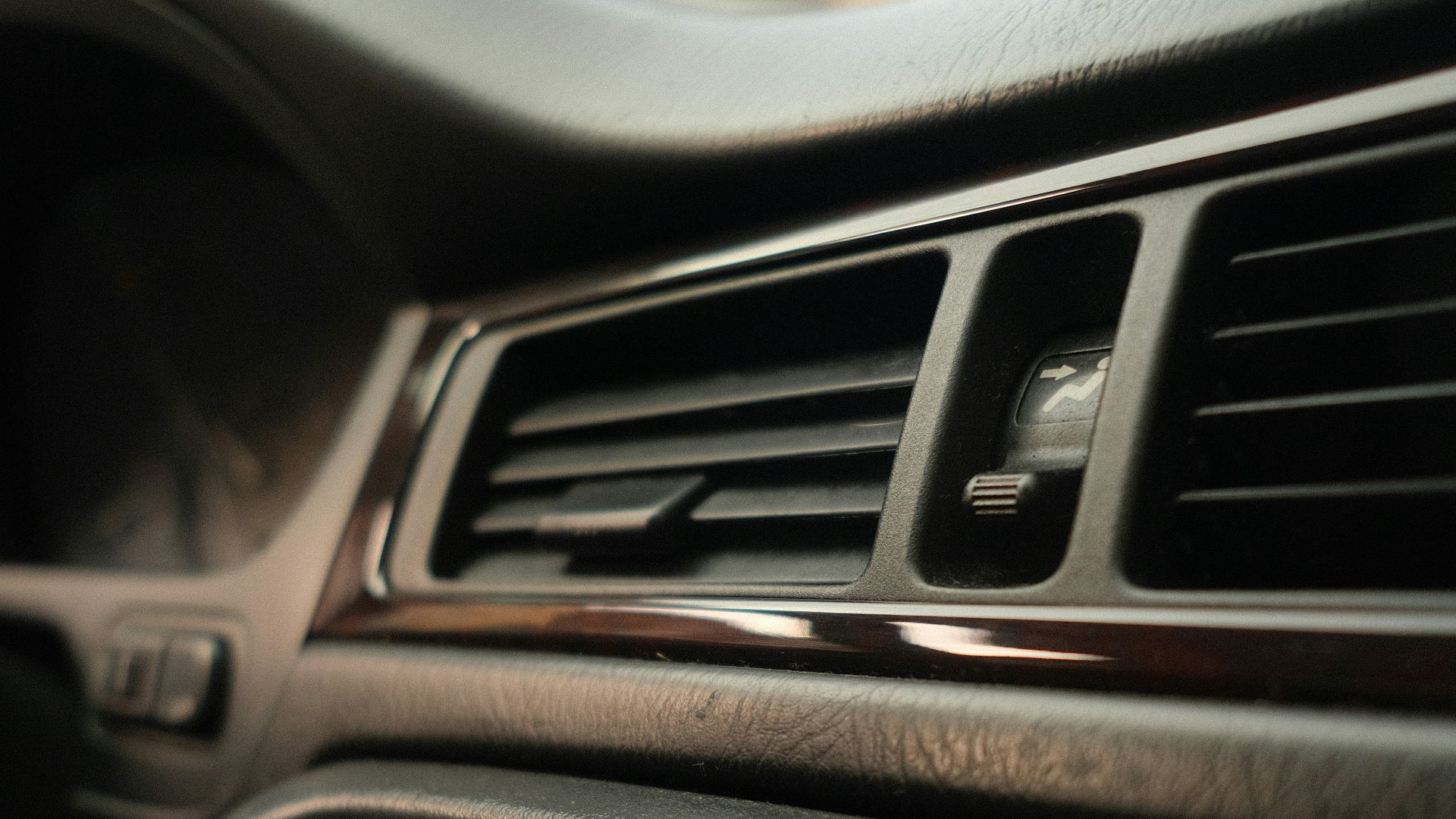 Car interior dashboard with air vents and buttons