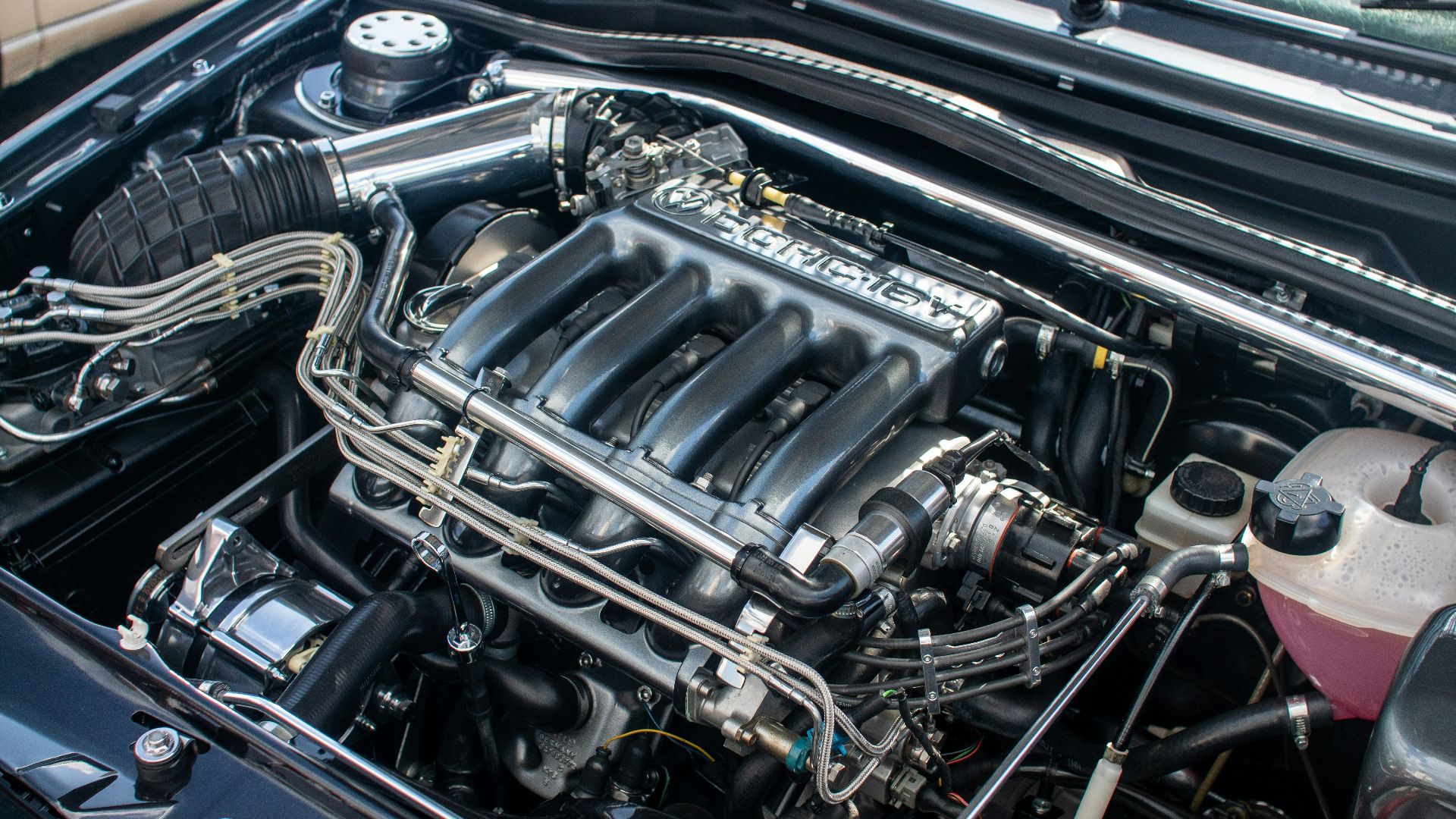 The engine compartment of a car with the hood up