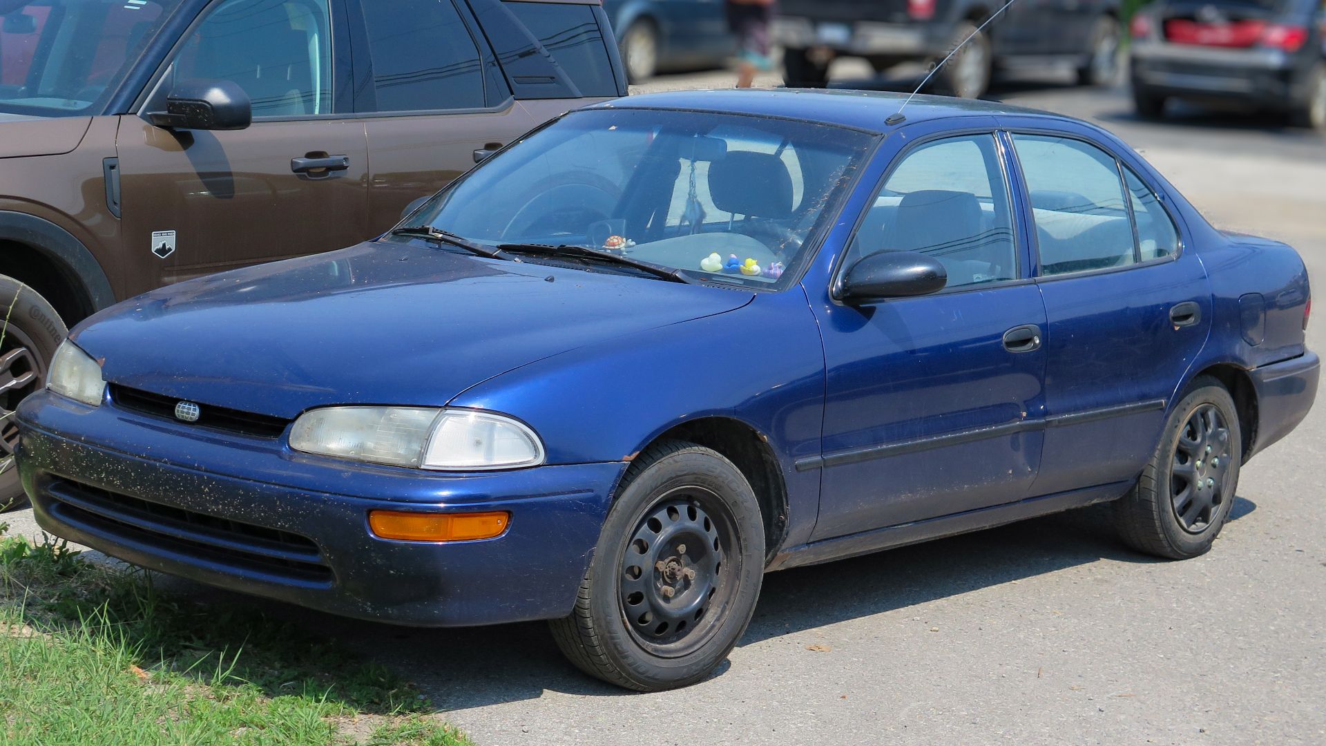 File:1997 Geo Prizm in Pacific Blue Pearl Metallic, Front Left (St. Ignace 2023).jpg
