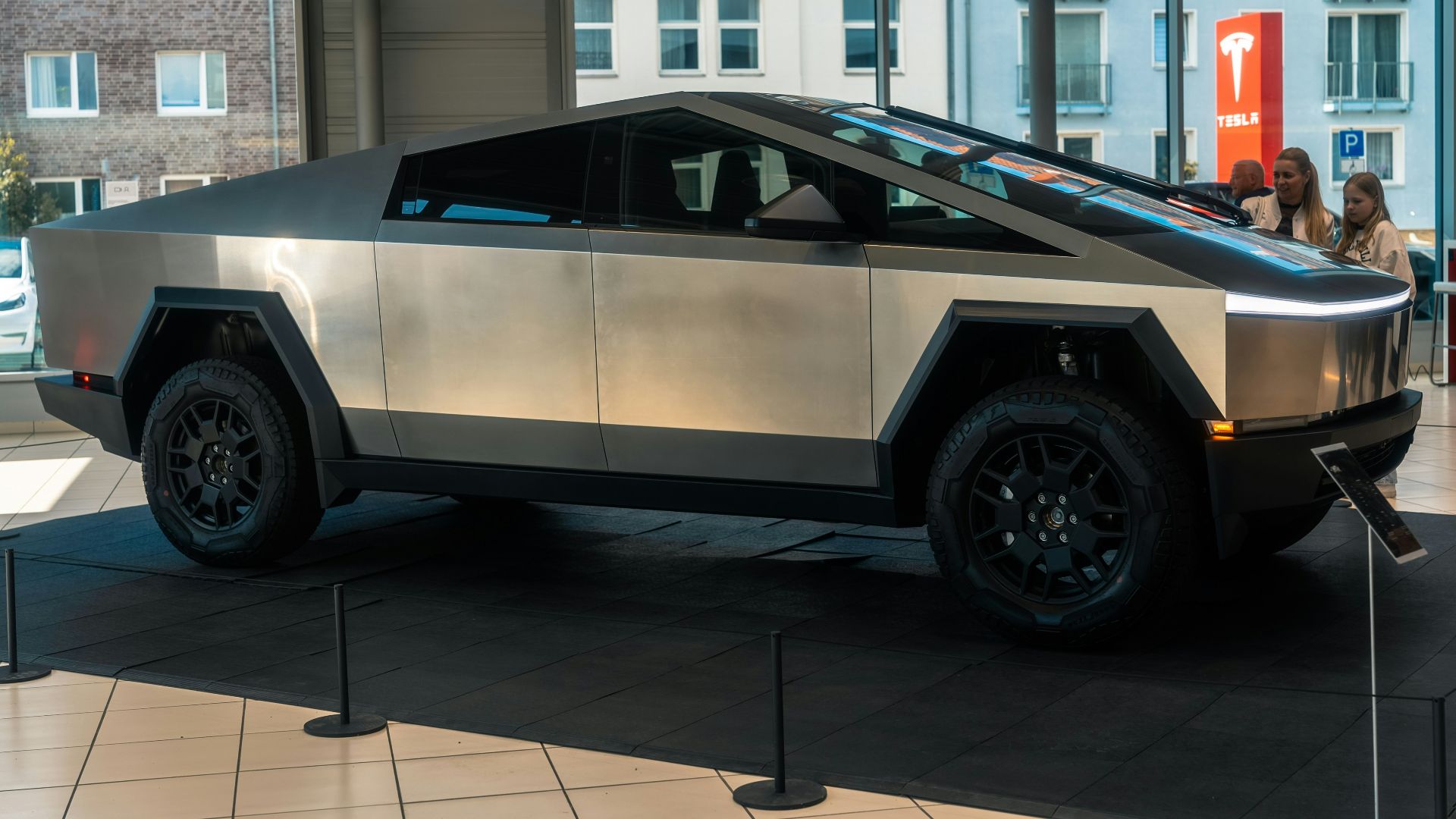 A futuristic car is on display in a building