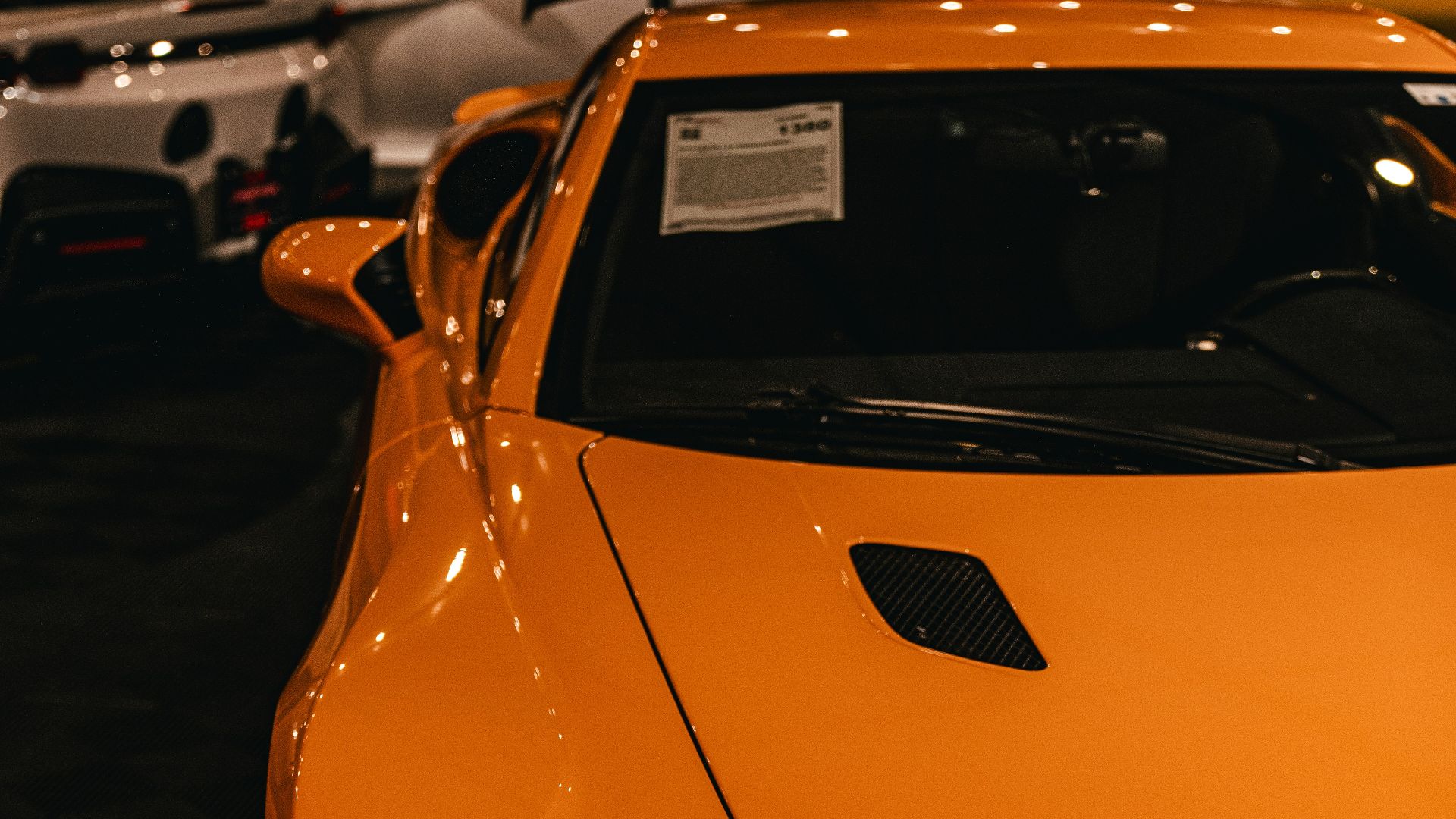 a close up of a sports car on display