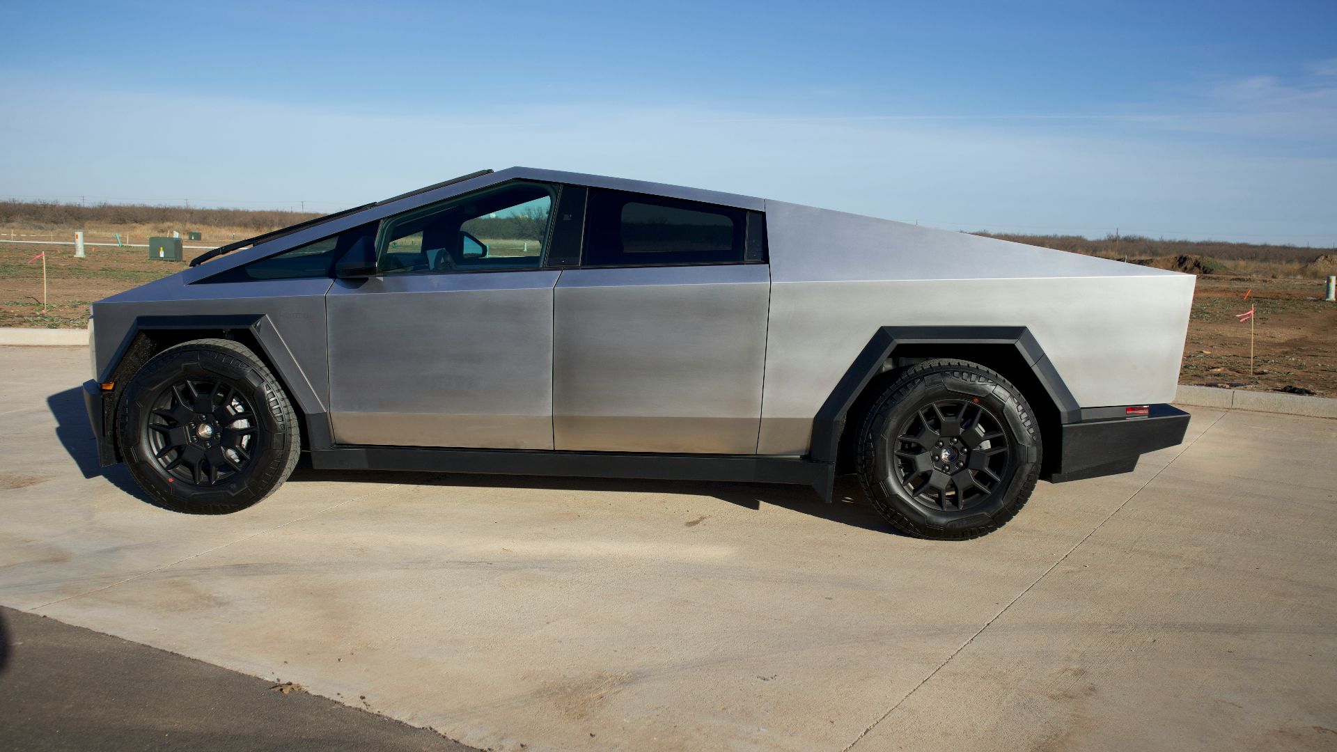 a futuristic car parked in a parking lot