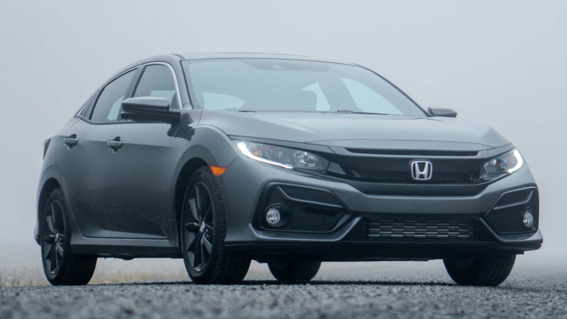 gray Honda sedan parked on road during day