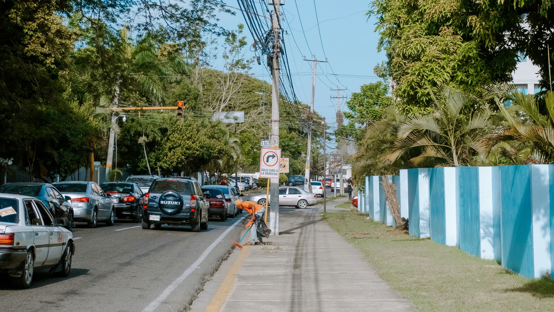 a street with cars parked on the side of it